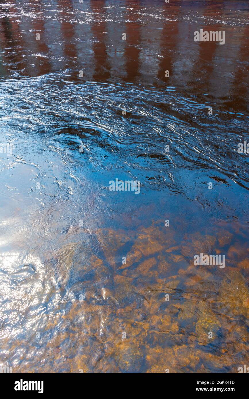 Reflection of Finlayson factory and Rocky bottom of Tammerkoski rapid in Tampere Finland Stock Photo