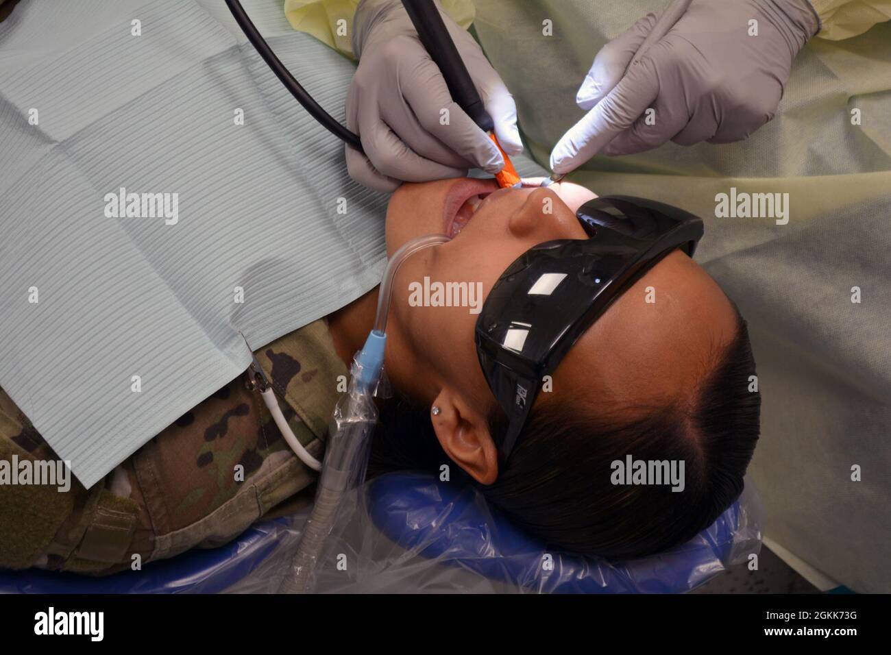Sgt. Karina Burgos, a Transportation Management Coordinator with the 7th  Mission Support Command, receives a dental exam at the Kleber Dental Clinic  Stock Photo - Alamy