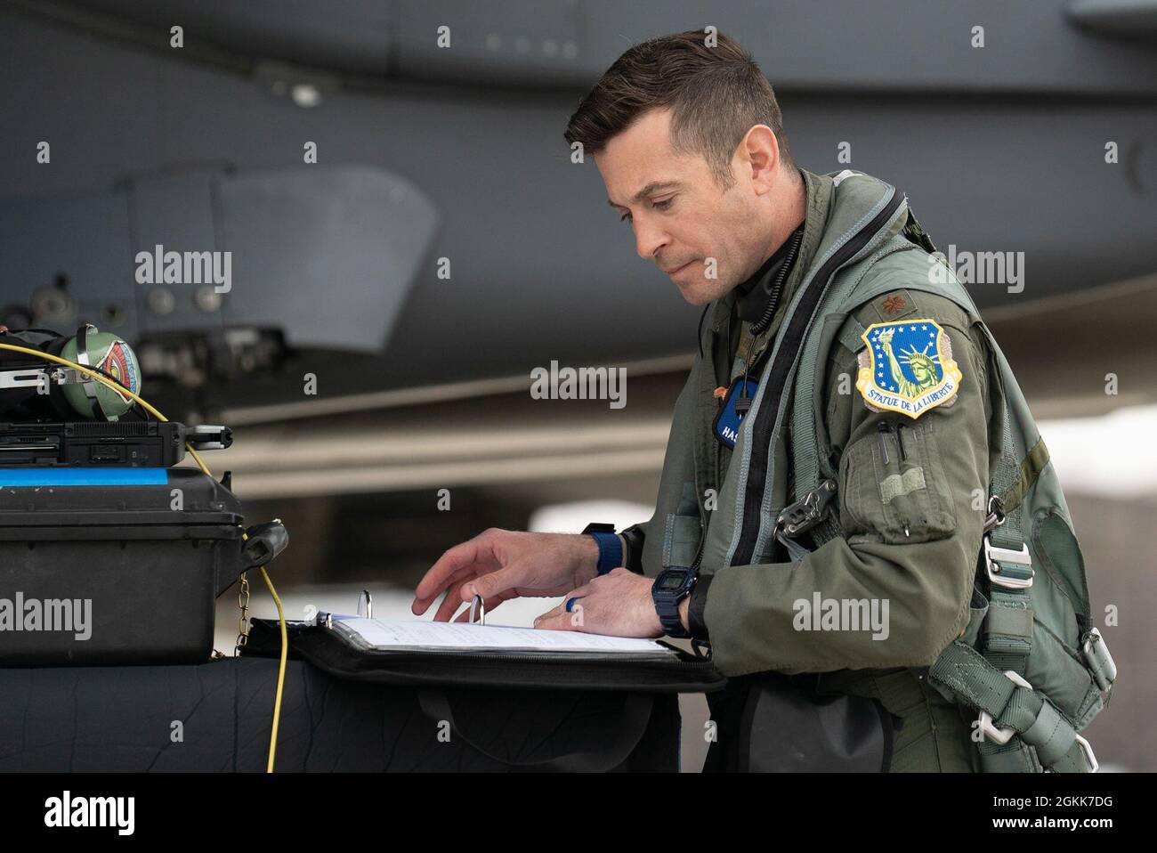 A U.S. Air Force pilot assigned to the 492nd Fighter Squadron reviews pre-flight documents during surge operations at Royal Air Force Lakenheath, England, May 13, 2021. Surge operations provide aircrew and support personnel the opportunity to hone the skills necessary to maintain a ready force, capable of ensuring the collective defense of the U.S., U.K. and the NATO alliance. Stock Photo