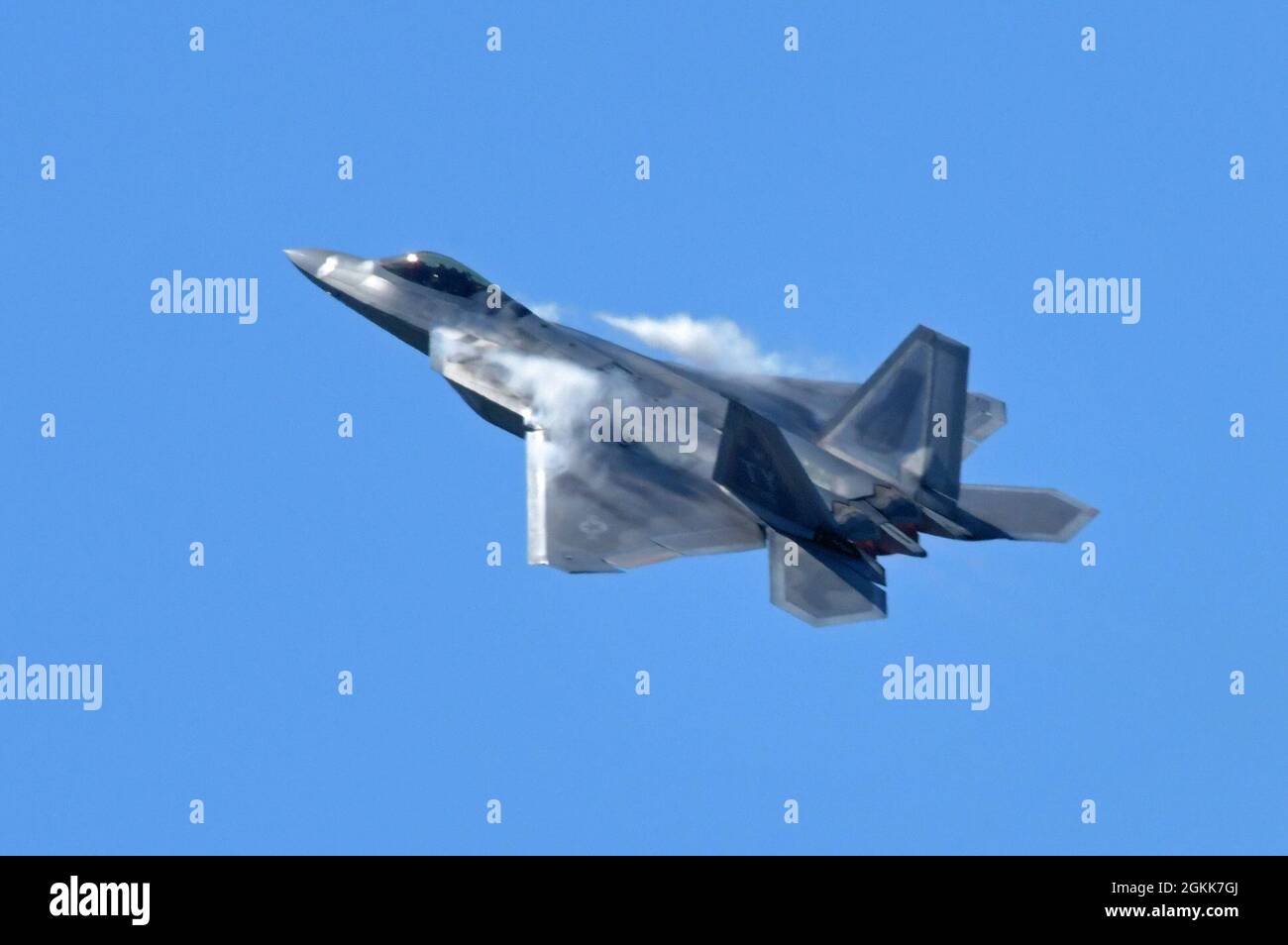 An F-22 Raptor Demonstration Team commander and pilot performs during an air demonstration at Maxwell Air Force Base, Alabama May 13, 2021.The F-22 possesses a sophisticated sensor suite allowing the pilot to track, identify, and shoot air-to-air threats before being detected. Stock Photo