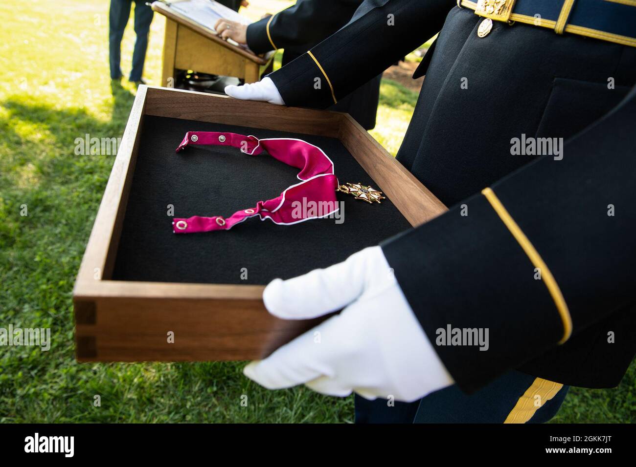 A U.S. Soldier assigned to the 3rd U.S. Infantry Regiment (The Old Guard) holds a Legion of Merit medal during an Army Full Honor Arrival Ceremony at Whipple Field, Joint Base Myer-Henderson Hall, Arlington, Va., May 13, 2021. The medal was awarded to General Sir Mark Alexander Carleton-Smith, the chief of the General Staff of the British Army, by Chief of Staff of the U.S. Army Gen. James C. McConville. Stock Photo
