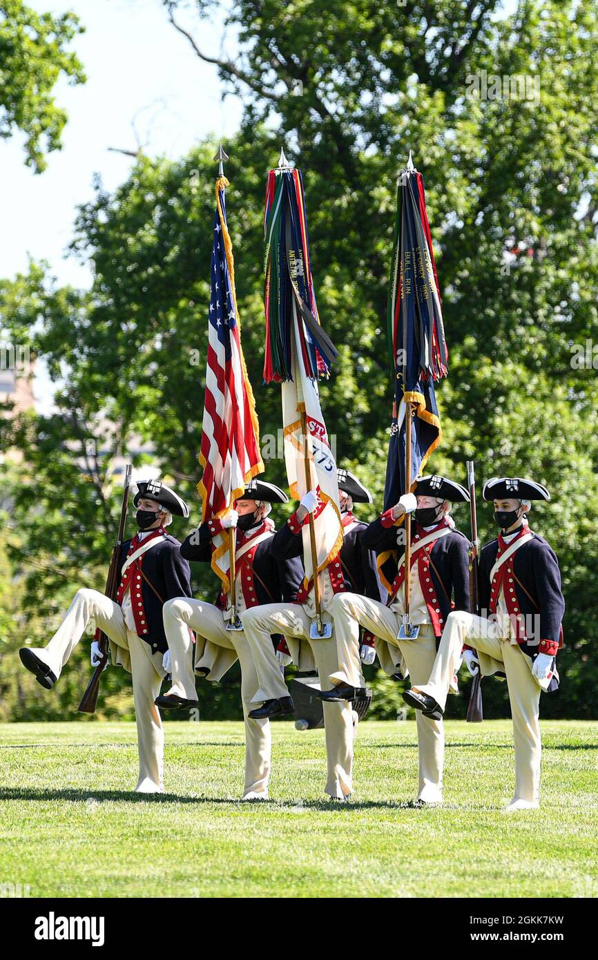 U.S. Soldiers assigned to the Continental Color Guard, 3rd U.S. Infantry Regiment (The Old Guard), participate in an Army Full Honor Arrival Ceremony welcoming General Sir Mark Alexander Carleton-Smith, the chief of the General Staff of the British Army, at Whipple Field, Joint Base Myer-Henderson Hall, Arlington, Va., May 13, 2021.   Chief of Staff of the U.S. Army Gen. James C. McConville hosted the event. Stock Photo