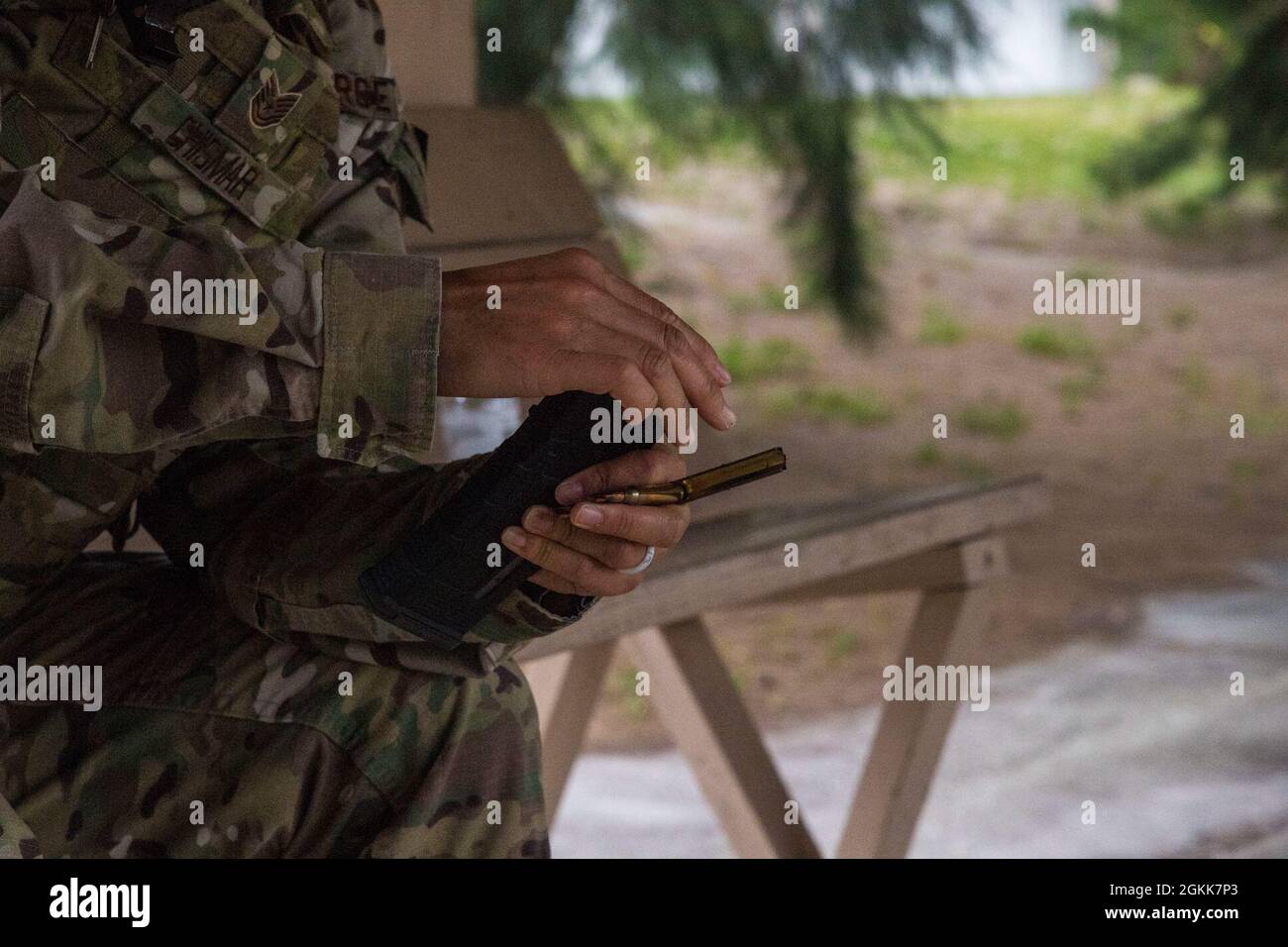 An Airman with the 6th Security Forces Squadron (SFS) loads a magazine