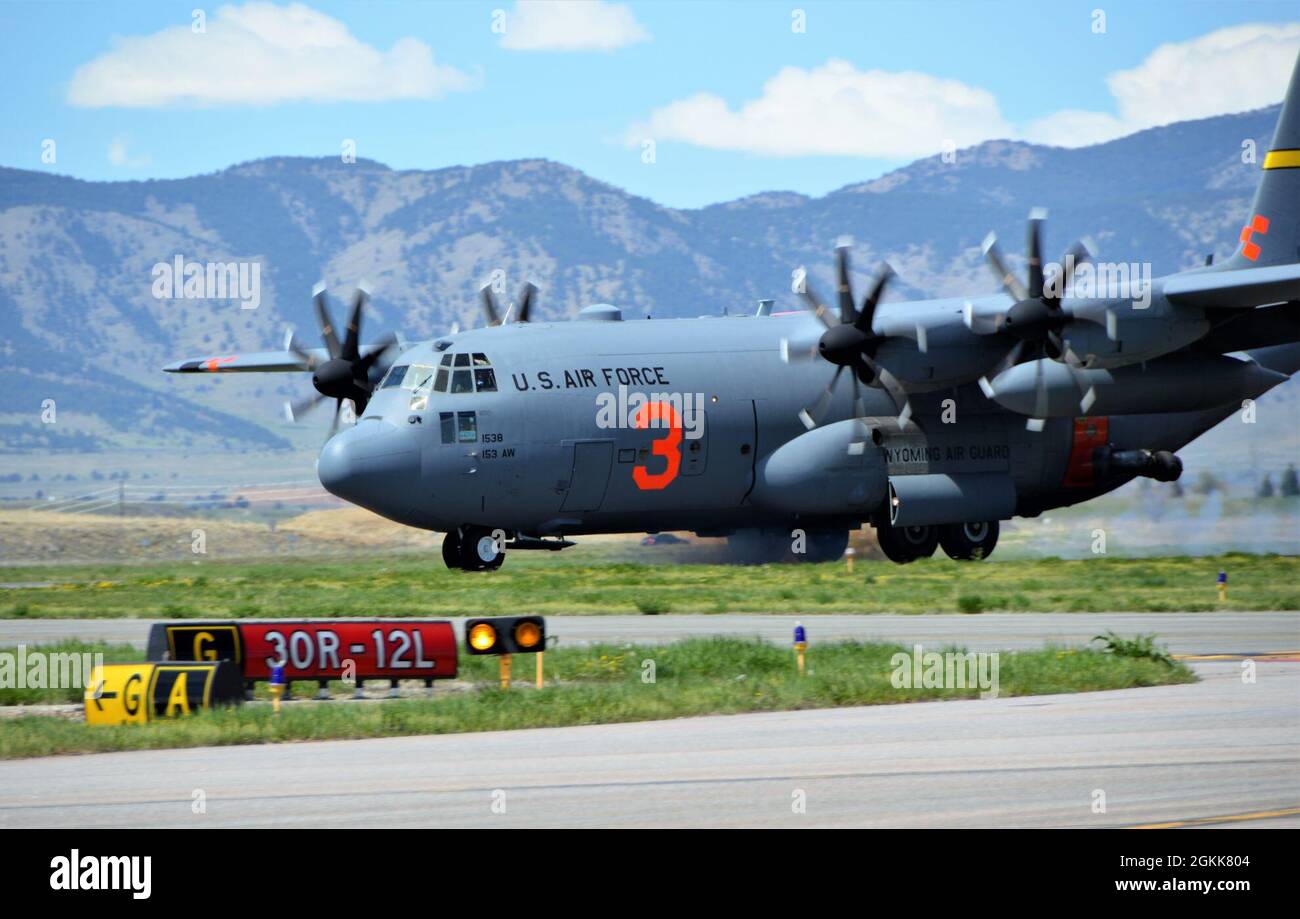 JEFFCO AIRTANKER BASE, Colo. --  A C-130 Hercules aircraft from the 153rd Airlift Wing lands after completing its training mission. The 153rd Airlift Wing is in Jefferson County, Colo., conducting annual aerial Wildland Firefighting (WFF) training and certification with the U.S. Department of Agriculture's Forest Service, using the USDA Forest Service-provided Modular Aerial Fire Fighting System (MAFFS) fixed aboard C-130 Hercules aircraft. Along with Colorado Springs' 302nd Airlift Wing, the units are conducting training drops with potable water over national forests and Bureau of Land Manage Stock Photo