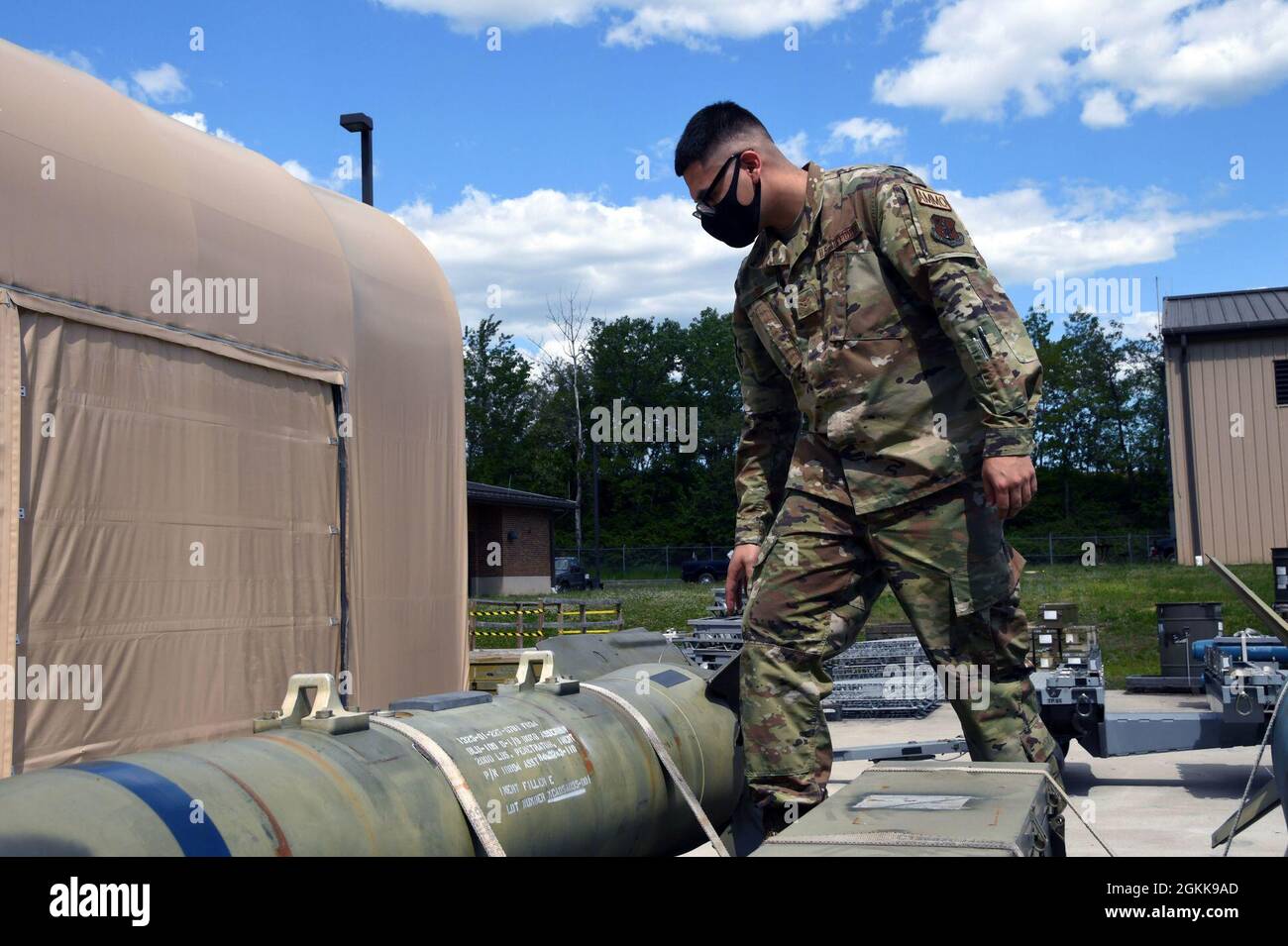 Airman First Class Carlos León, munitions systems technician, 113th Maintenance Squadron, secures a load, May 14, 2021, at Joint Base Andrews, Maryland. The 113th Wing is celebrating Asian American and Pacific Islander Heritage Month, honoring the contributions of Asians and Pacific Islanders to the history, culture and achievements of the United States. Stock Photo