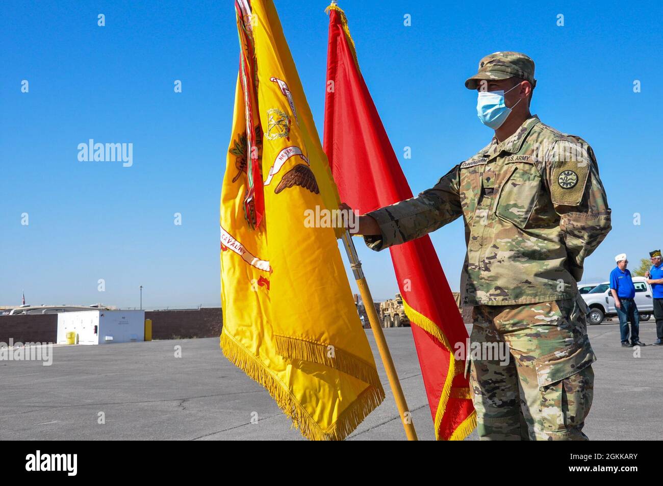 A Soldier from 1st Squadron 221 Cavalry hold a flag during the Veterans of Foreign Wars Life Saving Award ceremony at the Clark County Armory, Friday, May 14, 2021 in Las Vegas, Nevada. Capts. Tyler Wistisen and Tana Gurule along with 1st Lt. Michael Flury helped rescue a Virginia woman after she crashed her car. All three Soldiers, who were activated at the time for Capitol Response, received the VFW Life Saving Award. Stock Photo