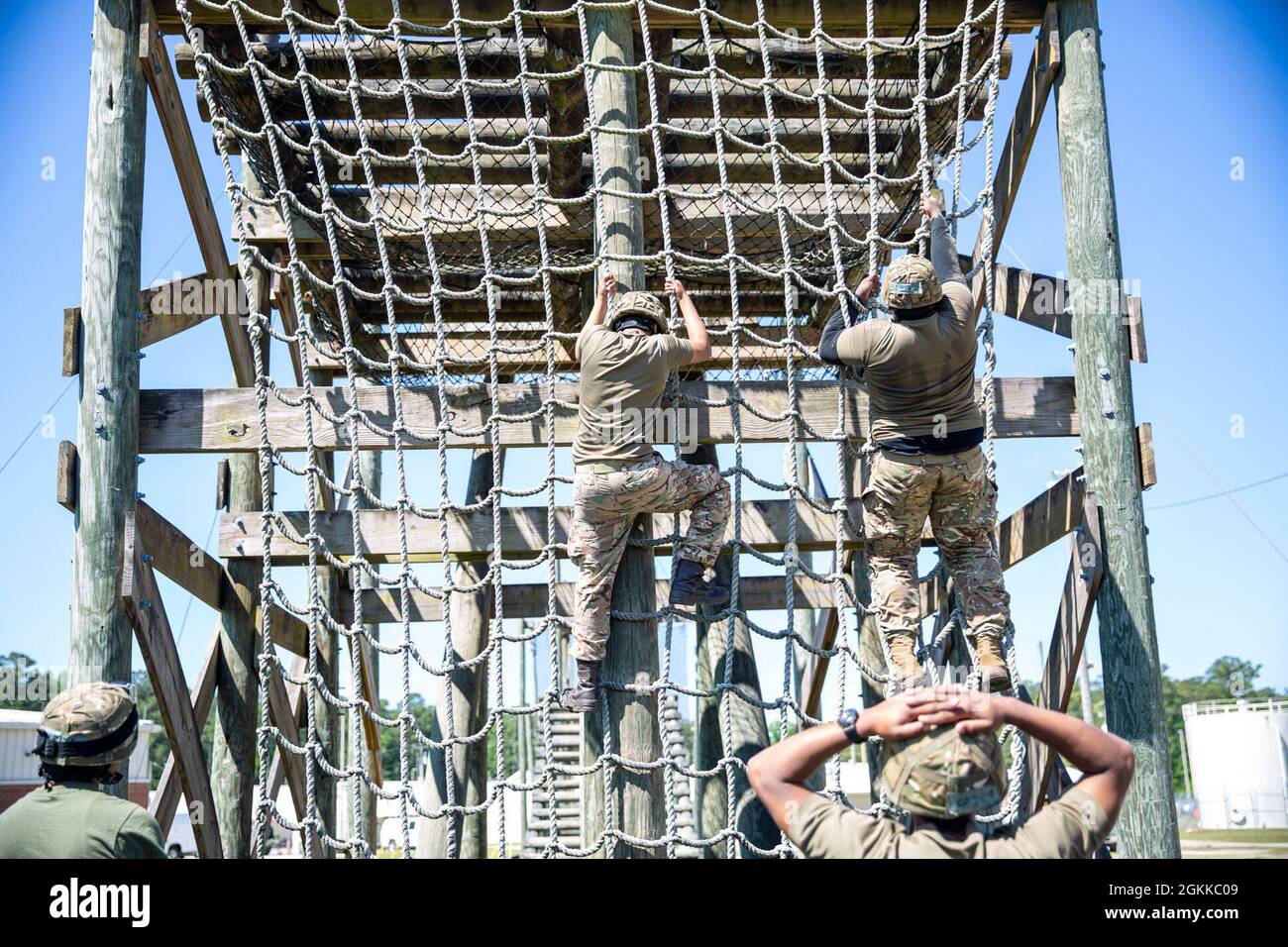 Royal Bermuda Soldiers climb over an obstacle in the Camp Devil Dog obstacle course on Camp Devil Dog, North Carolina, May 14, 2021.  MCB Camp Lejeune hosted the Royal Bermuda Regiment during Exercise Island Warrior. The exercise strengthened the partnership between the two forces and the training and resources provided by the base enhanced the warfighting skills and readiness of the Royal Bermuda Regiment. Stock Photo