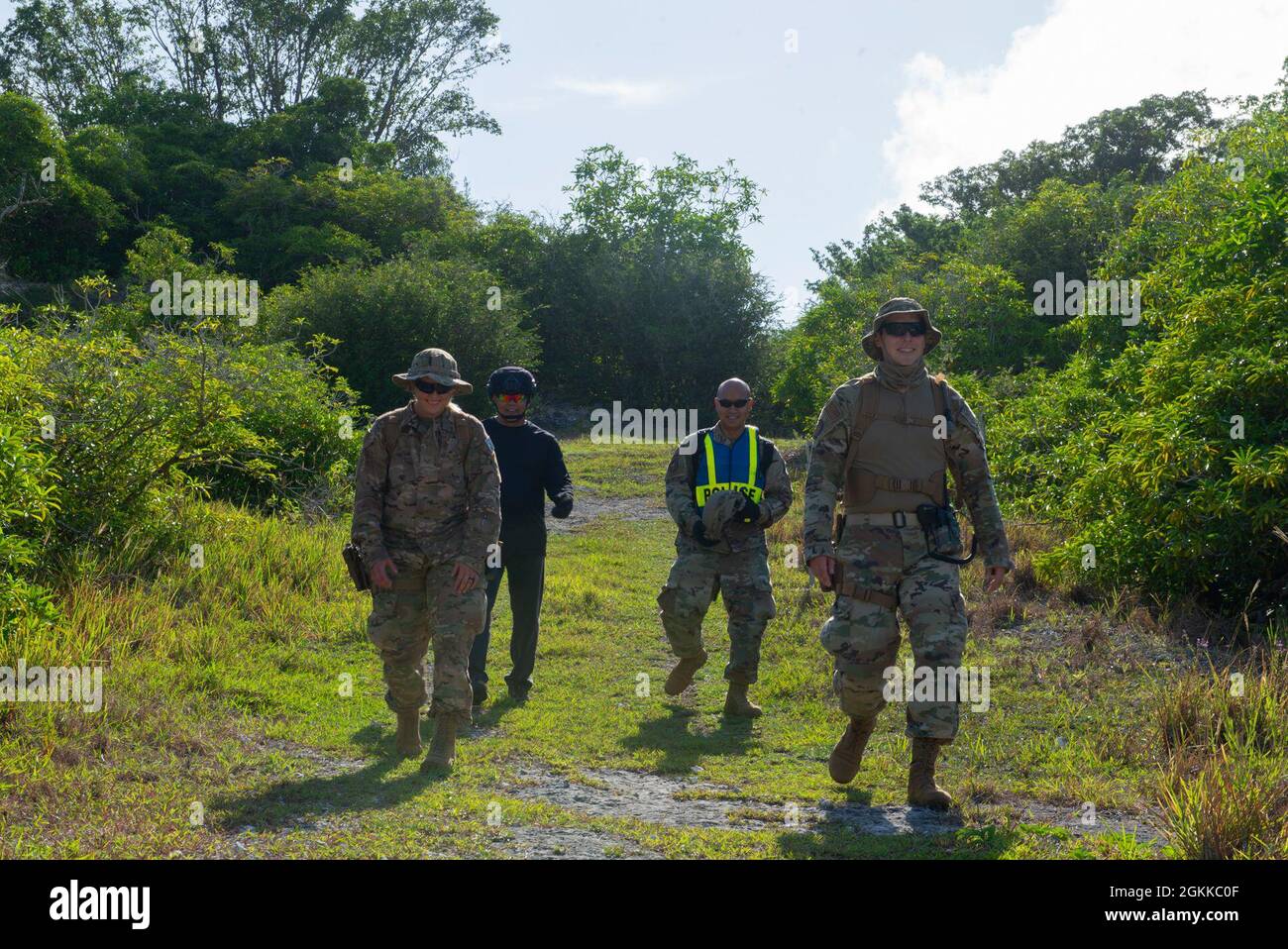 Airmen assigned to the 36th Security Forces Squadron perform a ground tasking operation through the uninhabited jungles on Andersen Air Force Base, Guam May 14 2021. Andersen Air Force Base covers 14,600 acres, more than half of which is undeveloped land. Stock Photo