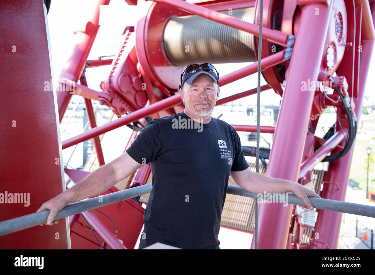 Crane operator Cary Hahn “Shorty” stands on a landing of the Quad Cities heavy lift crane, just