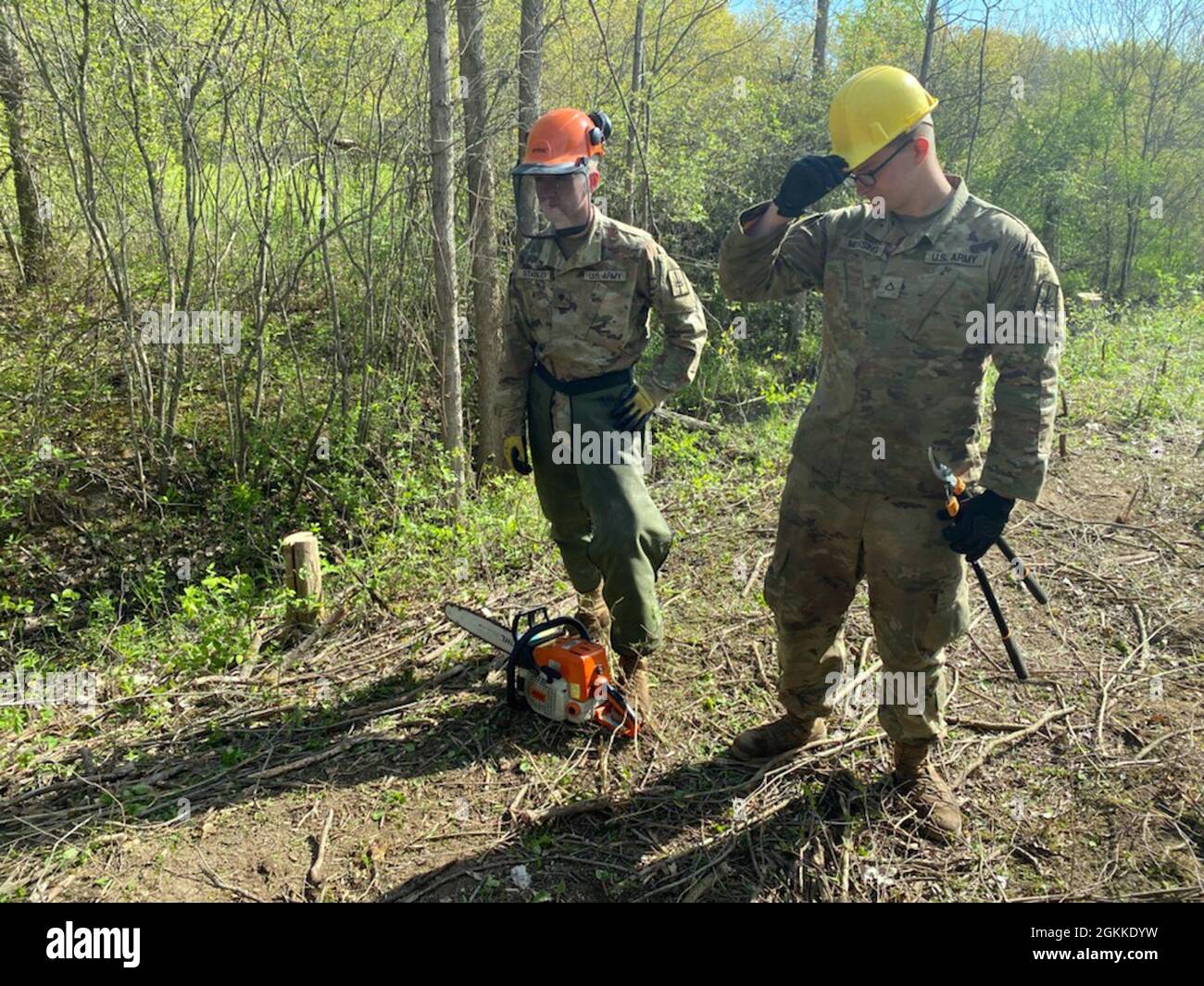 New York Army National Guard Spc. Zachary Stabler, left, and Pfc. Caleb Messing, assigned to the 152nd Engineer Company, prepare to continue debris removal and wood clearing in support of training lane construction at the National Guard Youngstown Local Training Area in Youngstown, N.Y., May 15, 2021 during unit annual training. The company returned to the field for collective training for engineer tasks after a year of virtual training, constructing an Army Combat Fitness Course, a Situational Training Exercise lanes course and a land navigation course. Stock Photo