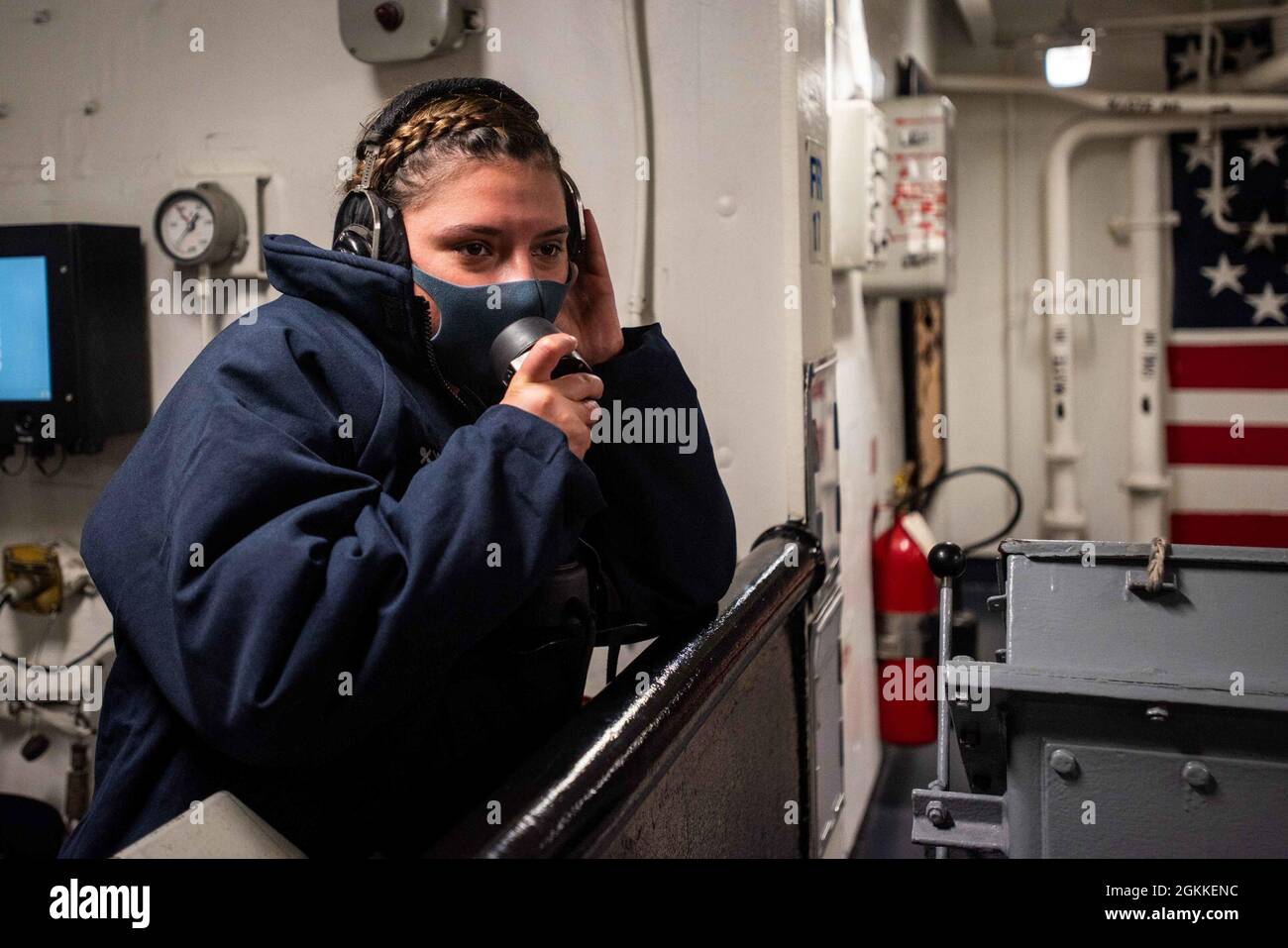 210516-N-WU964-1132 TOKYO BAY, Japan (May 16, 2021) Seaman Katheline Tamez, from Mcallen, Texas, operates sound powered telephone in the forecastle of the U.S. Navy’s only forward-deployed aircraft carrier, USS Ronald Reagan (CVN 76), as the ship returns to Commander, Fleet Activities Yokosuka following sea trials. Ronald Reagan, the flagship of Carrier Strike Group 5, provides a combat-ready force that protects and defends the United States, as well as the collective maritime interests of its allies and partners in the Indo-Pacific region. Stock Photo