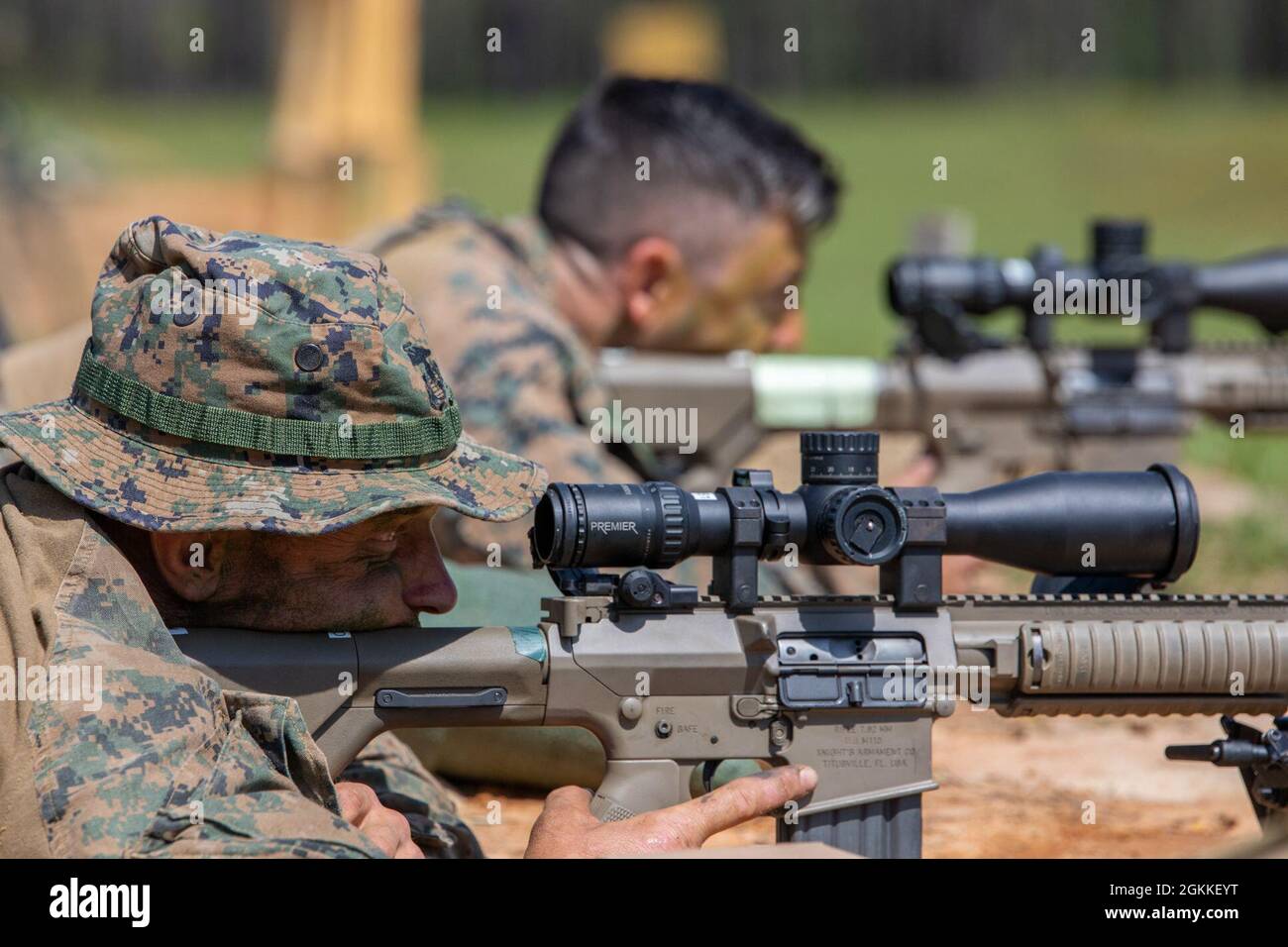 Marines with 3rd Force Reconnaissance Company, 4th Marine Division, prepare to fire at their targets during sniper training at Camp Shelby, Mississippi, on May 16, 2021. Marines train with the M110 semi-automatic sniper system, an anti-personnel and light material rifle that fires 7.62 mm ammunition, to maintain proficiency in long-range marksmanship. Stock Photo