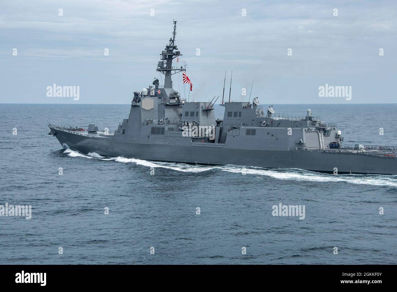 210516-N-WS494-1196 PHILIPPINE SEA (May 16, 2021) Japan Maritime Self-Defense Force guided-missile destroyer JS Maya (DDG 179) steams alongside the U.S. Navy’s only forward-deployed aircraft carrier, USS Ronald Reagan (CVN 76). Ronald Reagan, the flagship of Carrier Strike Group 5, provides a combat-ready force that protects and defends the United States, as well as the collective maritime interests of its allies and partners in the Indo-Pacific region. Stock Photo