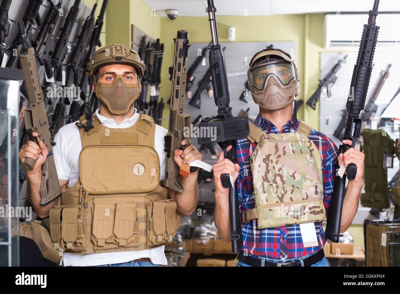 men in army uniform with gun in military market Stock Photo Alamy