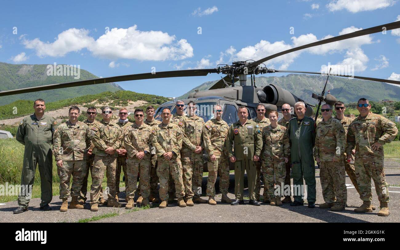 FARKE AIRFIELD, Albania) --- Flights crews belonging to the Albanian Air  Force and Alabama National Guard pose for a group photo in front of a UH-60  Blackhawk, May 18, 2021. Both groups