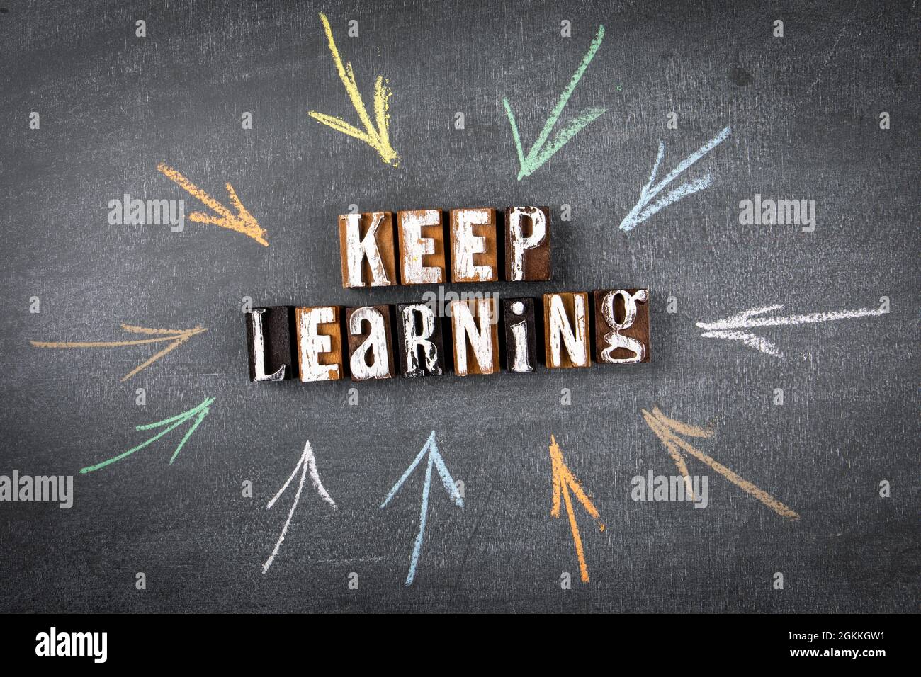 Keep Learning concept. Letters of the alphabet on a chalk board. Drawn ...