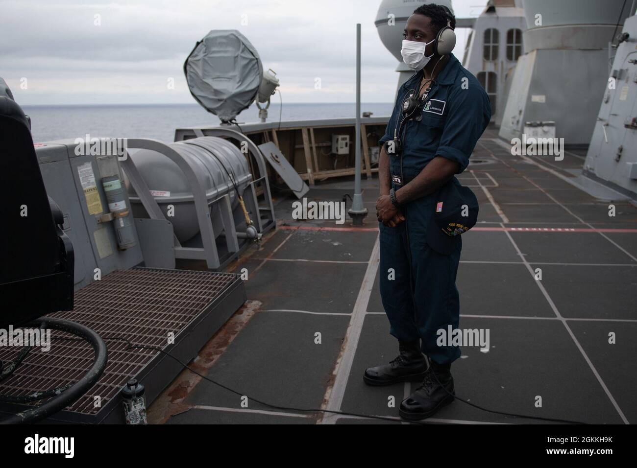 210517-N-XB010-1009 EAST CHINA SEA (May 17, 2021) Seaman Jordan Anderson, from Baton Rouge, La., stands starboard lookout watch on the USS New Orleans (LPD 18) starboard side bridge wing. New Orleans, part of the America Amphibious Ready Group, along with the 31st Marine Expeditionary Unit, is operating in the U.S. 7th Fleet area of responsibility to enhance interoperability with allies and partners and serve as a ready response force to defend peace and stability in the Indo-Pacific region. Stock Photo
