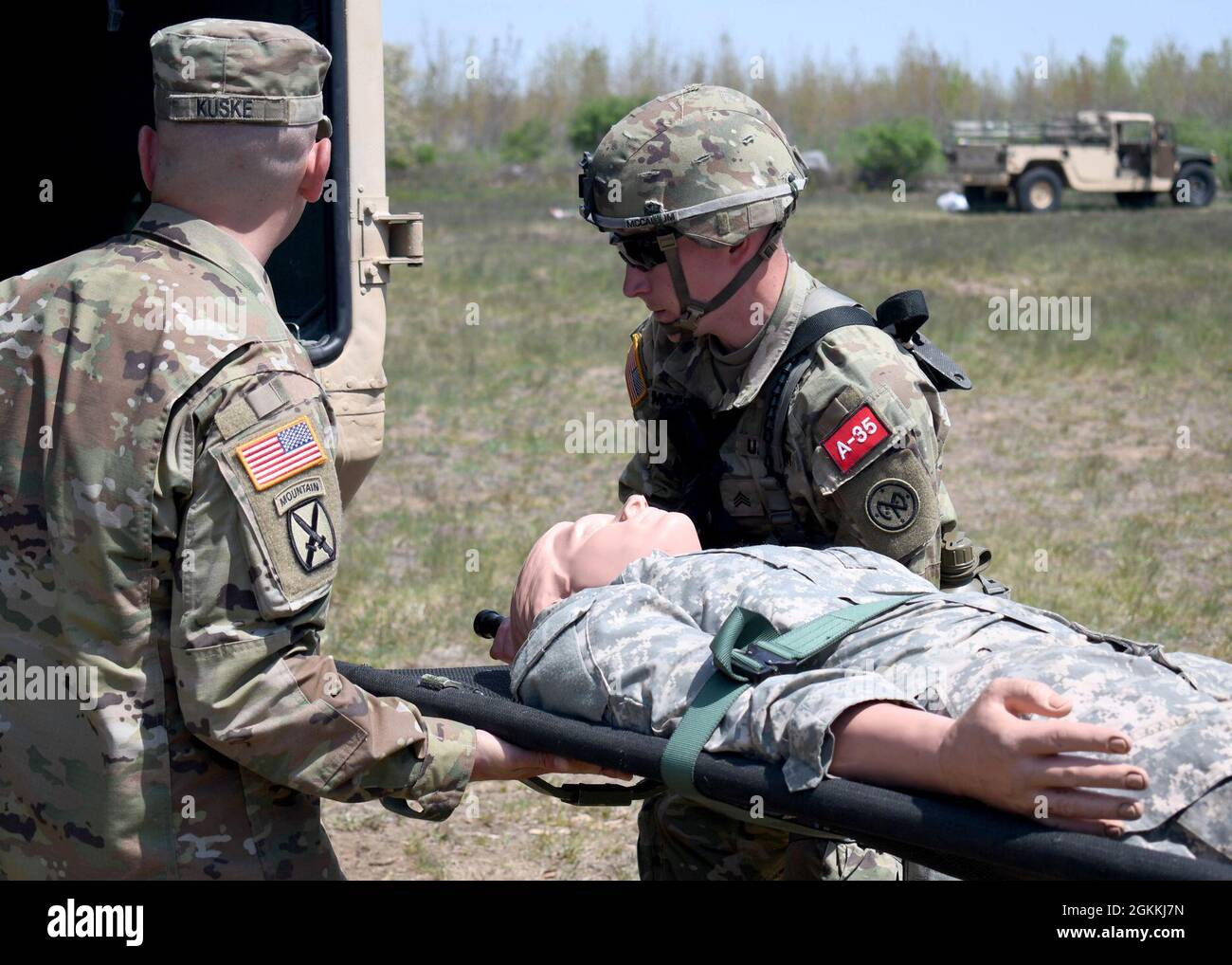 https://c8.alamy.com/comp/2GKKJ7N/fort-drum-ny-us-army-sgt-klayton-mccallum-a-combat-medic-with-the-new-york-national-guards-2nd-battalion-108th-infantry-regiment-lifts-a-simulated-casualty-into-a-military-ambulance-vehicle-as-part-of-a-testing-lane-during-the-10th-mountain-division-expert-field-medical-badge-efmb-assessment-at-fort-drum-ny-may-18-2021-the-efmb-is-awarded-to-field-medical-personnel-who-demonstrate-exceptional-competence-and-outstanding-performance-during-the-testing-phase-receiving-a-go-on-all-stages-of-assessment-including-land-navigation-physical-fitness-a-road-march-and-multiple-2GKKJ7N.jpg