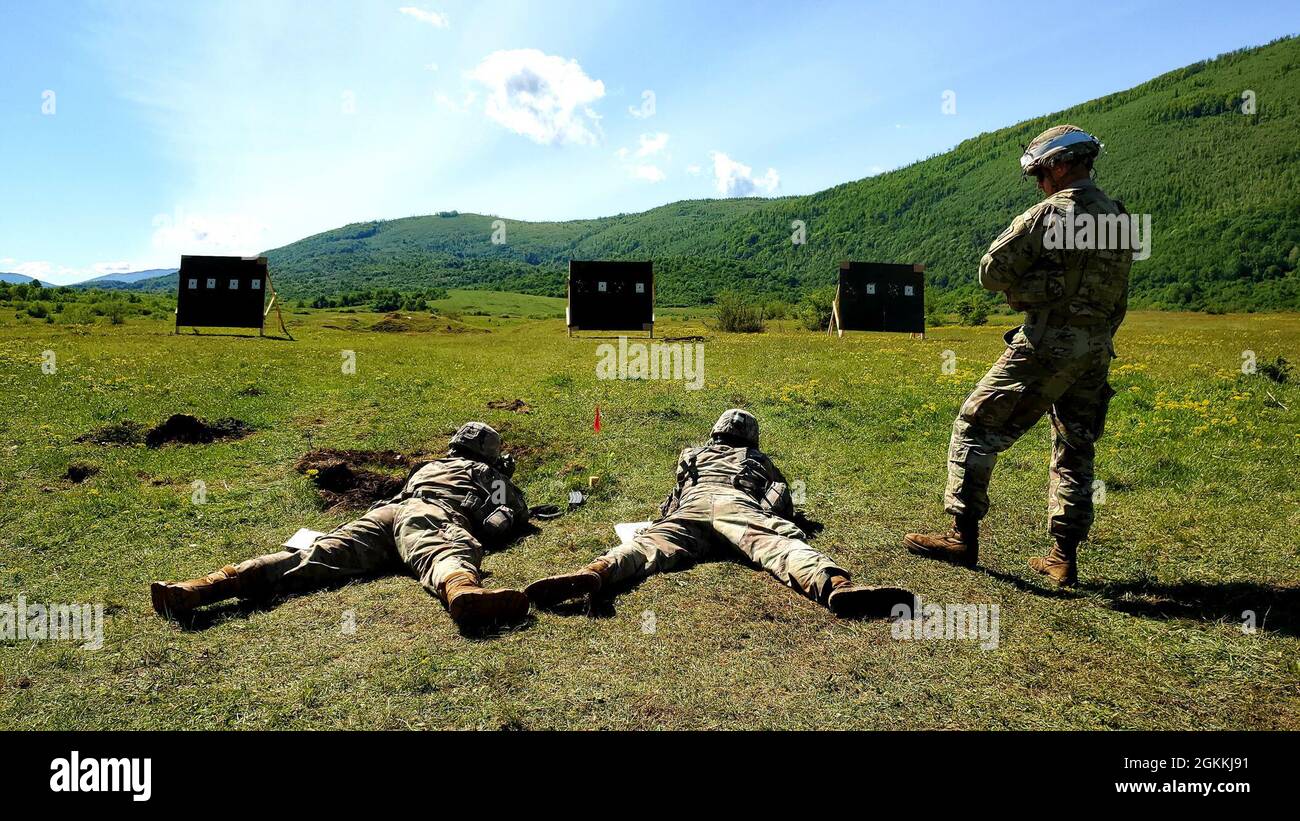 Soldiers with the Florida Army National Guard’s 2nd Battalion, 124th Infantry Regiment, 53rd Infantry Brigade Combat Team, zero their M4A1 Carbine rifles at Manjača Training Area, Bosnia and Herzegovina (BiH), May 18, 2021. The U.S. Soldiers joined BiH Armed Forces to conduct joint training for Immediate Response 21, a logistics-focused exercise designed to test and improve the ability to move forces and equipment rapidly from one location to another. The exercise supports DEFENDER-Europe 21, a multinational joint exercise that will demonstrate and develop the extensive military capabilities t Stock Photo