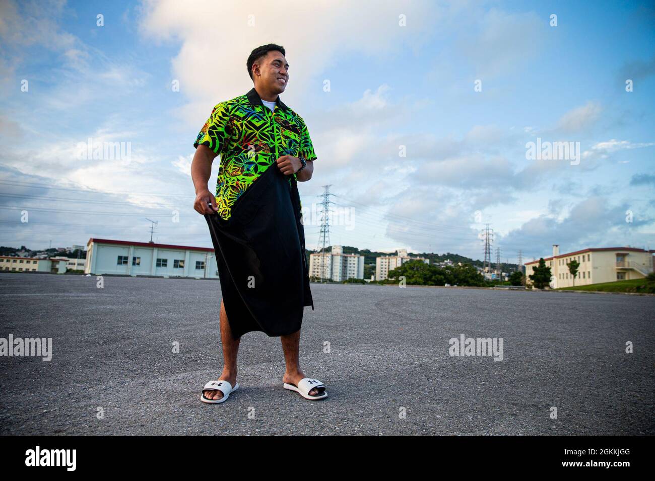 U.S. Marine Corps Cpl. Michael Auvaa, the inbound personnel first-stage noncommissioned officer-in-charge at the Installation Personnel Administration Center (IPAC), displays a lavalava, a traditional Samoan skirt on Camp Foster, Okinawa, Japan, May 18, 2021. The month of May represents and pays tribute to Asian-American and Pacific-Islander heritage, and recognizes the contribution and influences their cultures made which play an instrumental part in the past, present and future success of the United States of America. Auvaa grew up in A’asu, a village on the north coast of Tutuila Island, Am Stock Photo