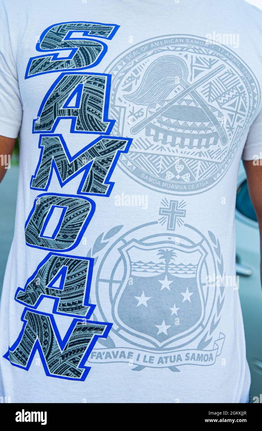 U.S. Marine Corps Cpl. Michael Auvaa, the inbound personnel first-stage noncommissioned officer-in-charge at the Installation Personnel Administration Center (IPAC), displays a Samoan shirt on Camp Foster, Okinawa, Japan, May 18, 2021. The month of May represents and pays tribute to Asian-American and Pacific-Islander heritage, and recognizes the contribution and influences their cultures made which play an instrumental part in the past, present and future success of the United States of America. Auvaa grew up in A’asu, a village on the north coast of Tutuila Island, American Samoa, and moved Stock Photo