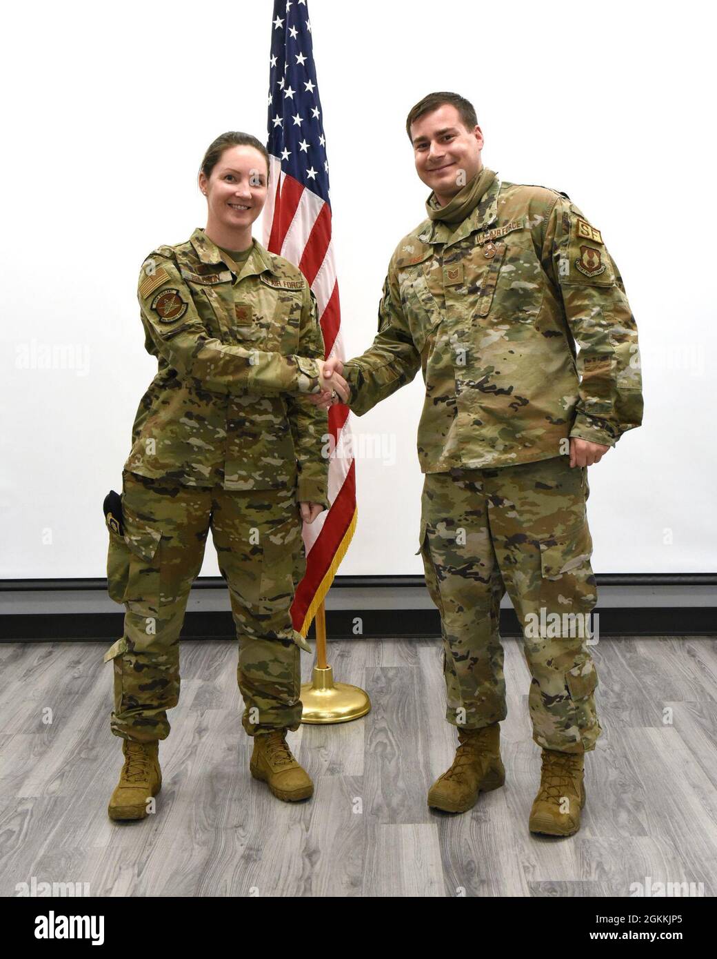 U.S. Air Force Maj. Julie Roloson, commander, 88 Security Forces Squadron, left, with National Police Week shooting contest rifle winner Tech. Sgt. Steven Fried at Wright-Patterson Air Force Base, Ohio on May 18, 2021. The shooting competition included the M-4 carbine and the M-18 pistol. Stock Photo