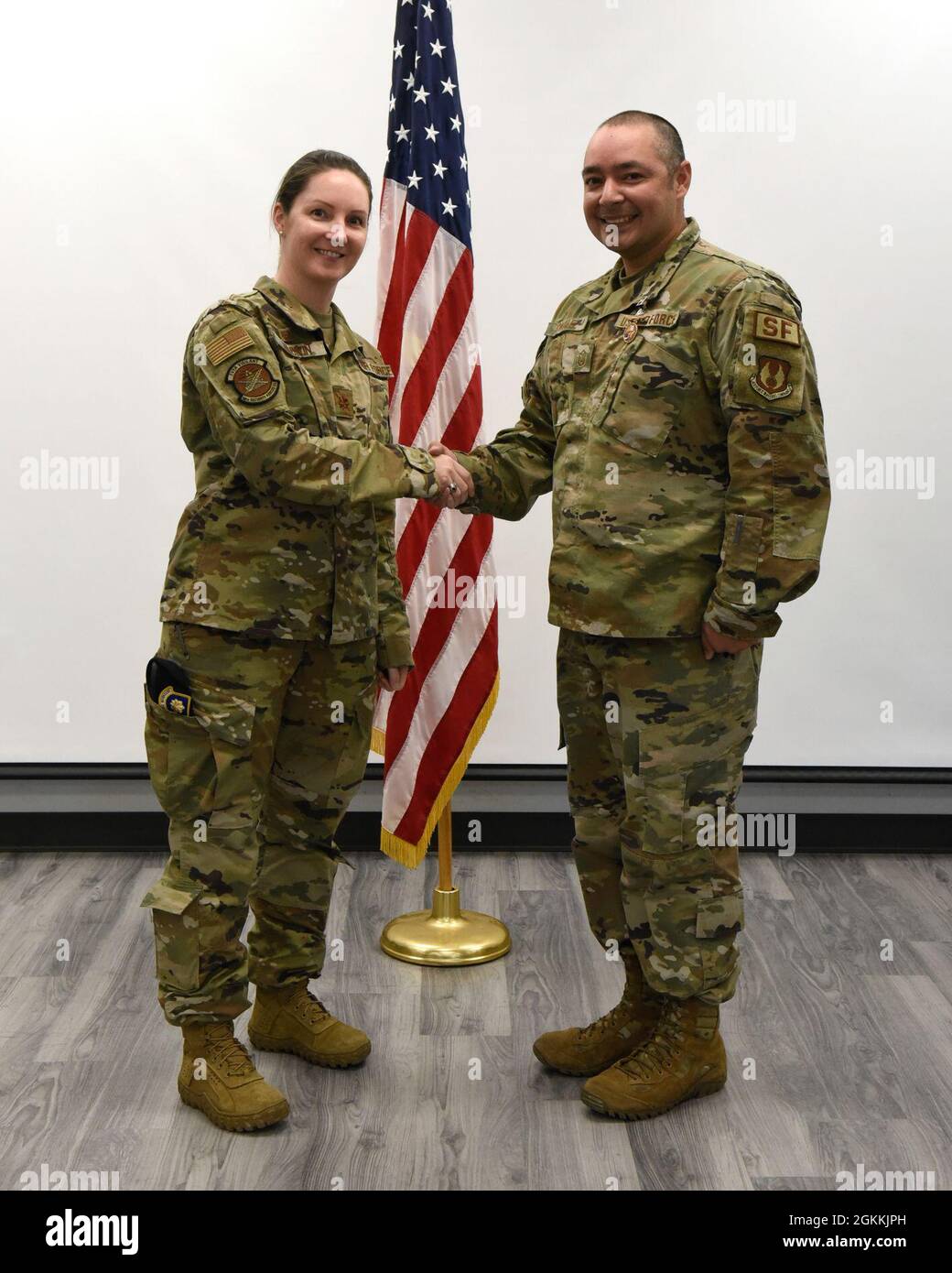 U.S. Air Force Maj. Julie Roloson, commander, 88 Security Forces Squadron, left, with National Police Week shooting contest place winner Master Sgt. Jesus Gonzalez at Wright-Patterson Air Force Base, Ohio on May 18, 2021. The shooting competition included the M-4 carbine and the M-18 pistol. Stock Photo