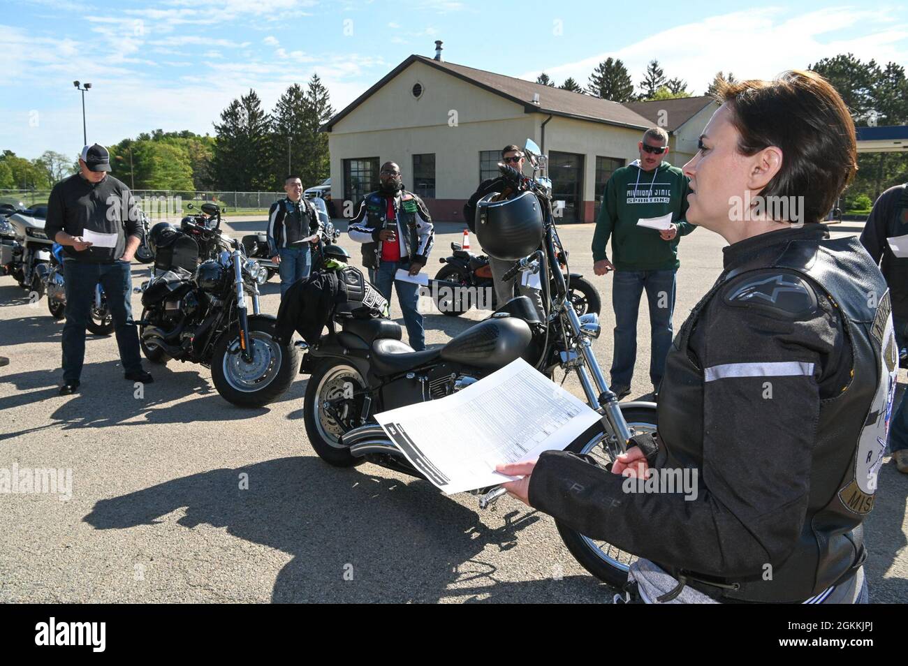 Master Sgt. Jennifer Deinhart, right, 66th Medical Squadron Tricare Operations and Patient Administration flight chief, conducts a safety briefing during a Motorcycle Mentorship Ride event held at Hanscom Air Force Base, Mass., May 18. Stock Photo