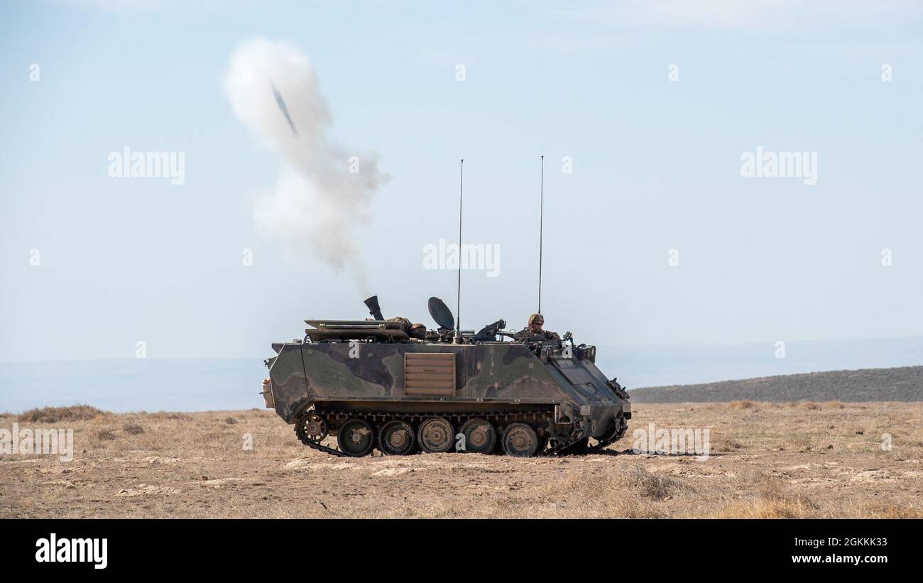 Soldiers from the Idaho Army National Guard’s 2-116 Combined Arms Battalion launch mortars from an M1129 Mortar Carrier at the Orchard Combat Training Center south of Boise, Idaho, May 18, 2021. The soldiers were working with A-10 Thunderbolt IIs from the 124th Fighter Wing, firing live mortars to mimic realistic combat suppression and hostile engagement scenarios. Stock Photo