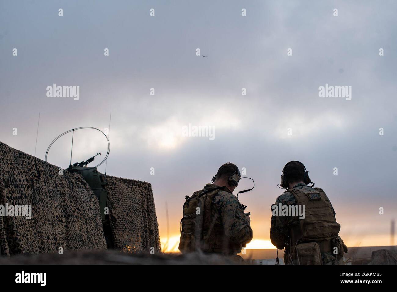 U.S. Marine Corps Capt. David Kolbach, left, a joint terminal air ...