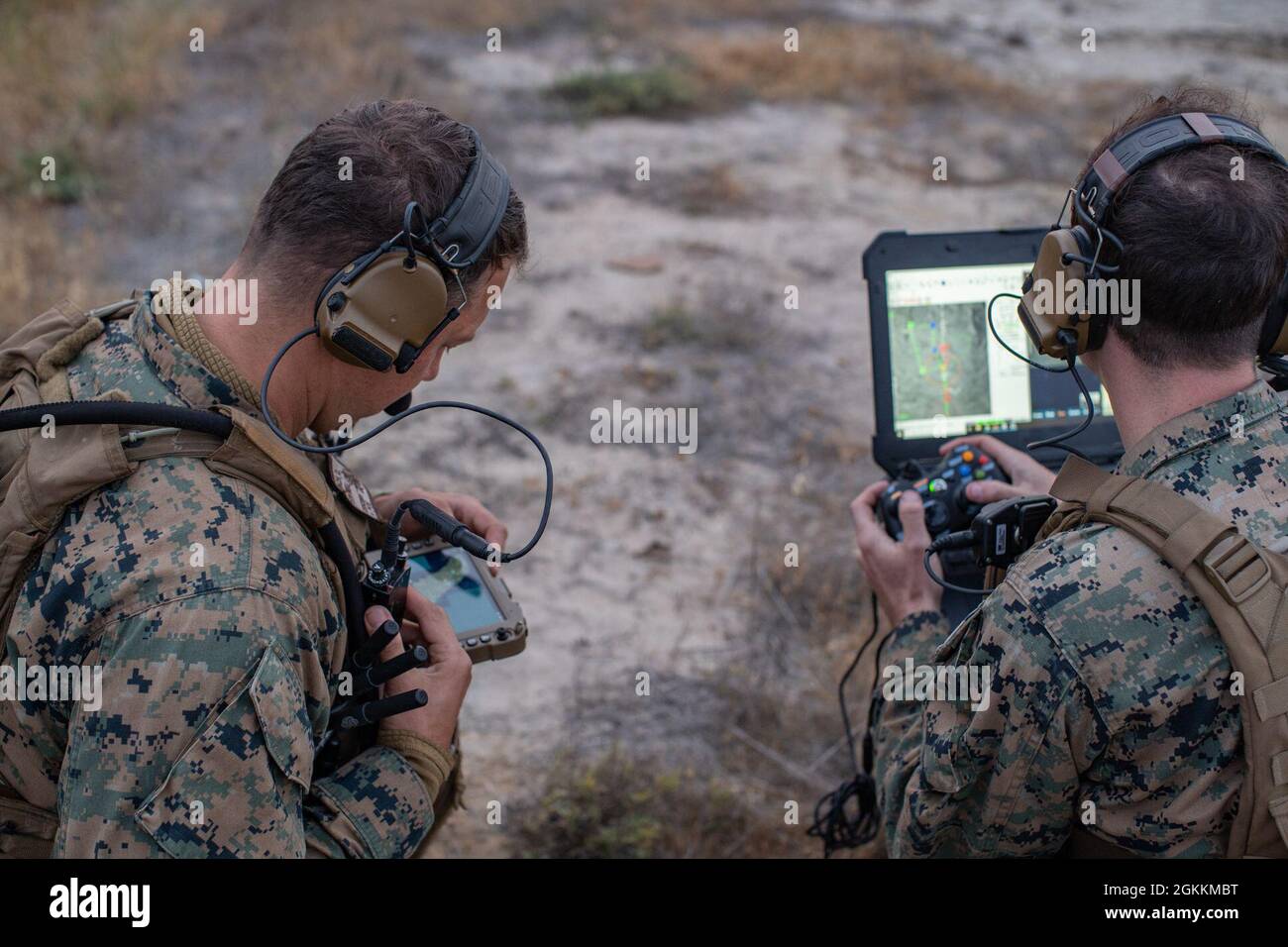 U.S. Marine Corps Capt. David Kolbach, left, a joint terminal air ...