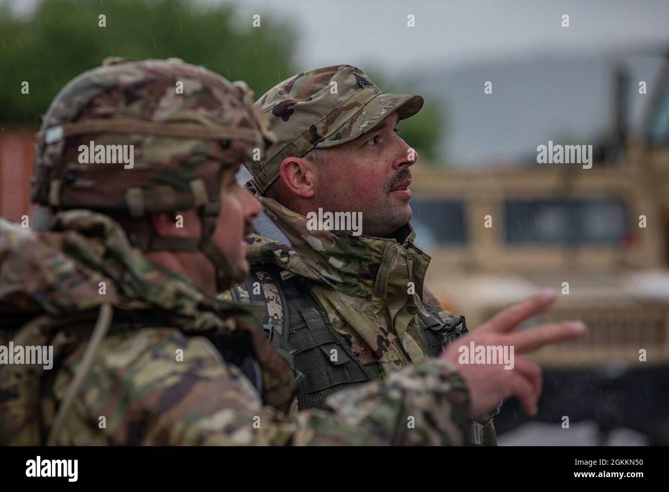 Two Soldiers assigned to Florida National Guard’s 2nd Battalion, 124th Infantry Regiment, 53rd Infantry Brigade Combat Team, prepare to depart from Manjača Training Area to Glamoč, Bosnia and Herzegovina on May 19, 2021.The 2-124th will conduct joint exercises with the Armed Forces of Bosnia and Herzegovina for Immediate Response 21, an effort that supports DEFENDER-Europe 21. DEFENDER-Europe 21 and linked exercises demonstrate and develop the extensive military capabilities that NATO allies and partners need to prevent conflict, preserve peace and keep our nations safe. Stock Photo