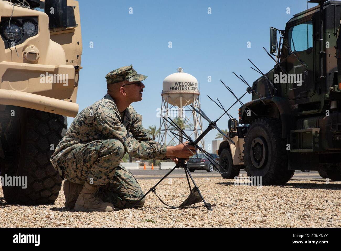 U.S. Marine Corps Lance Cpl. D'kota Hernandez, a radio operator, adjusts an  antenna on Luke Air Force Base, Arizona. Marines with 2nd Transportation  Battalion, Combat Logistics Regiment 2, 2nd Marine Logistics Group