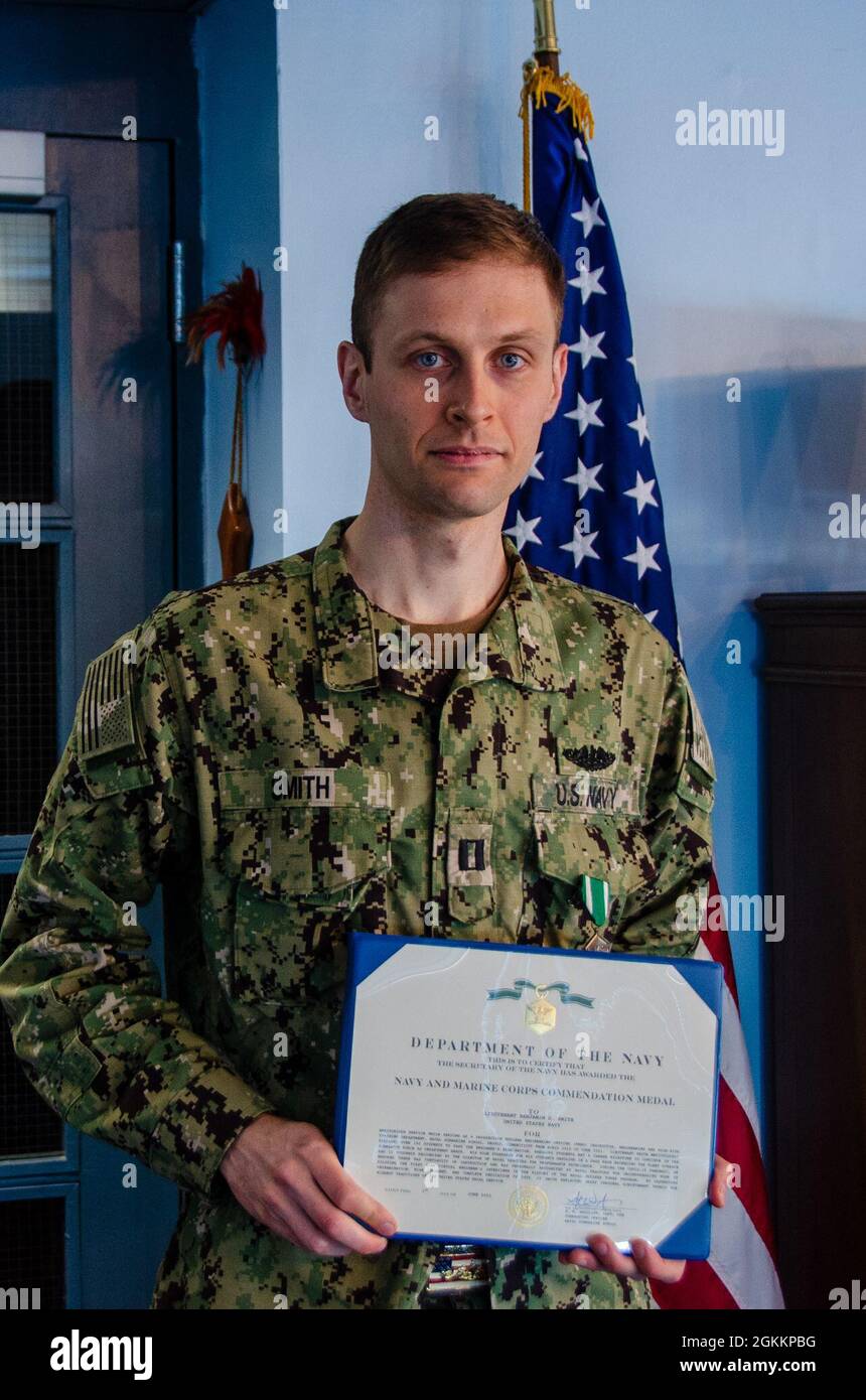 Lt. Benjamin D. Smith is presented the Navy and Marine Corps 