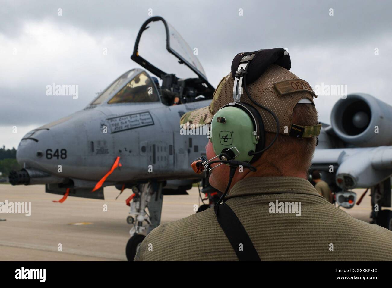 An Airman from the 354th Fighter Squadron stands in front of an A-10 ...