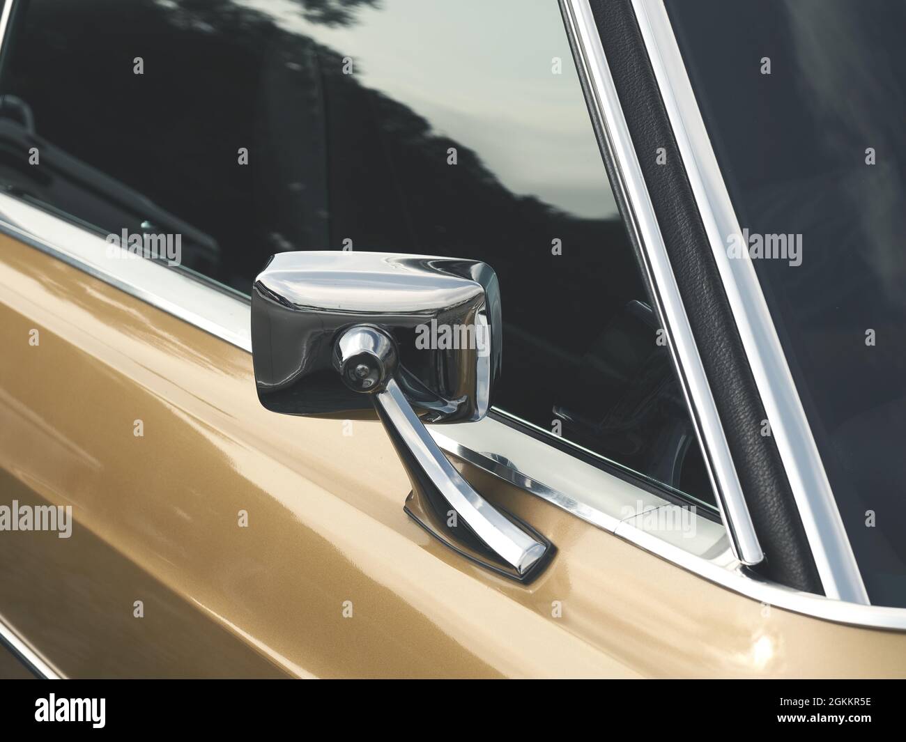 Sideview mirror of an old vintage car, conceptual vintage background