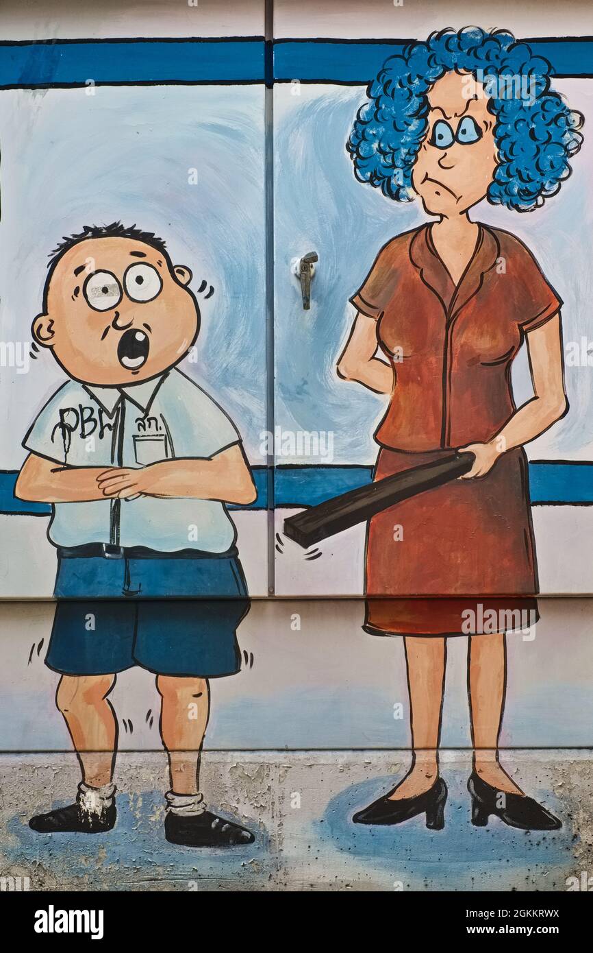 Cartoon-like painting of a mother punishing her student son, painted on an electric transformer in Bangkok, Thailand Stock Photo