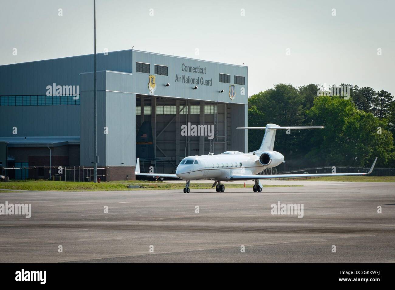 A C37B aircraft taxis to park on the flight line at Bradley Air