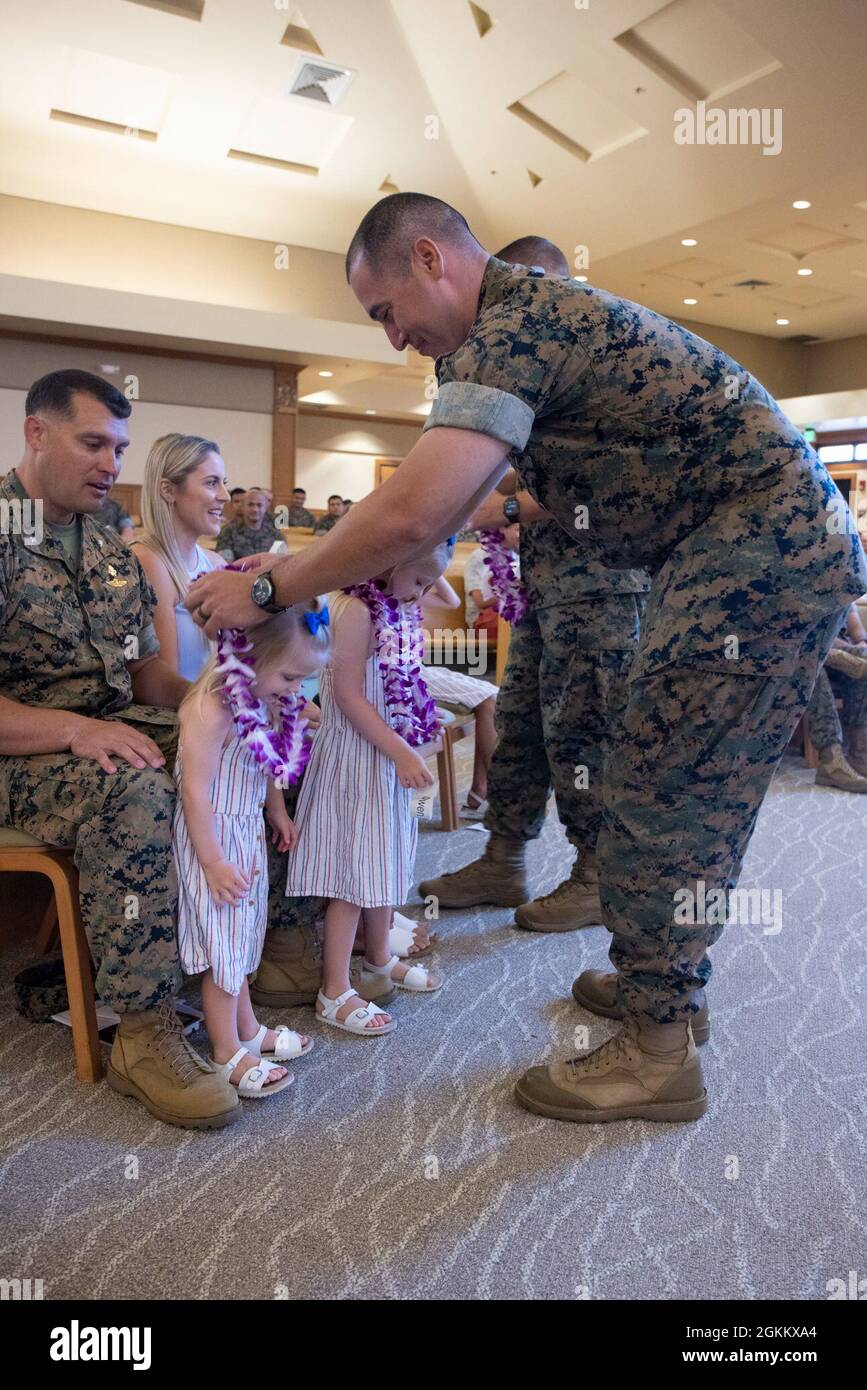 U.S. Marines with 3rd Radio Battalion deliver traditional Hawaiian lei