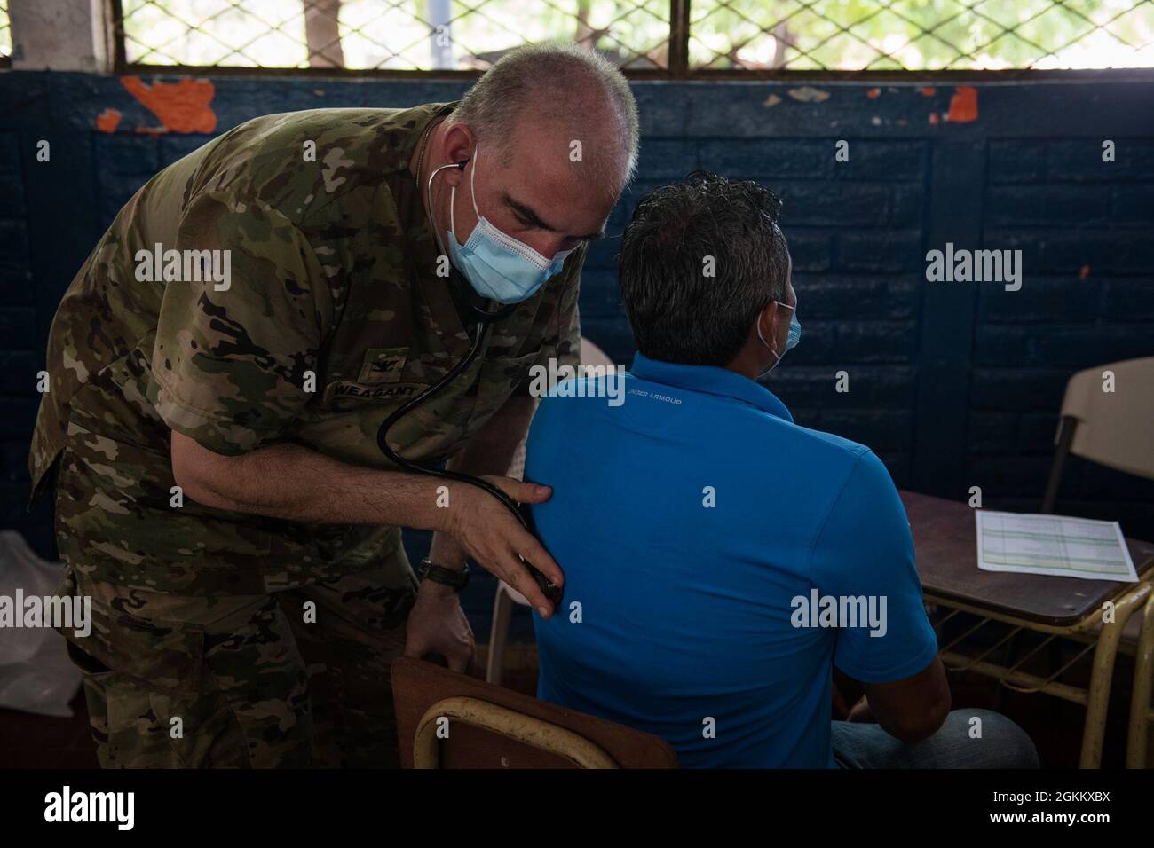 U.S. Army Col. Lance Weagant, a medical provider with the Medical Element, Joint Task Force-Bravo (JTF-B), Soto Cano Air Base, Honduras, treats a Salvadoran patient during a medical readiness training exercise for Resolute Sentinel 21 in El Jaguey, El Salvador, May 20, 2021. Resolute Sentinel 21 is a training opportunity with real-world benefits to increase Joint Task Force-Bravo’s medical and operational readiness while helping local citizens in El Salvador. Stock Photo