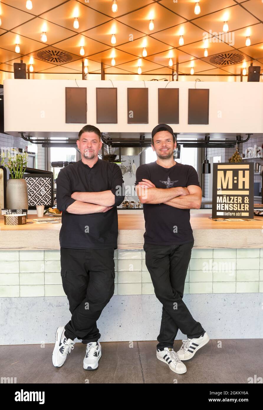 Hamburg, Germany. 30th July, 2021. Hamburg chefs Tim Mälzer (l) and Steffen  Henssler present their new cooking show "Mälzer und Henssler liefern ab!",  which will air on Vox in the fall. This
