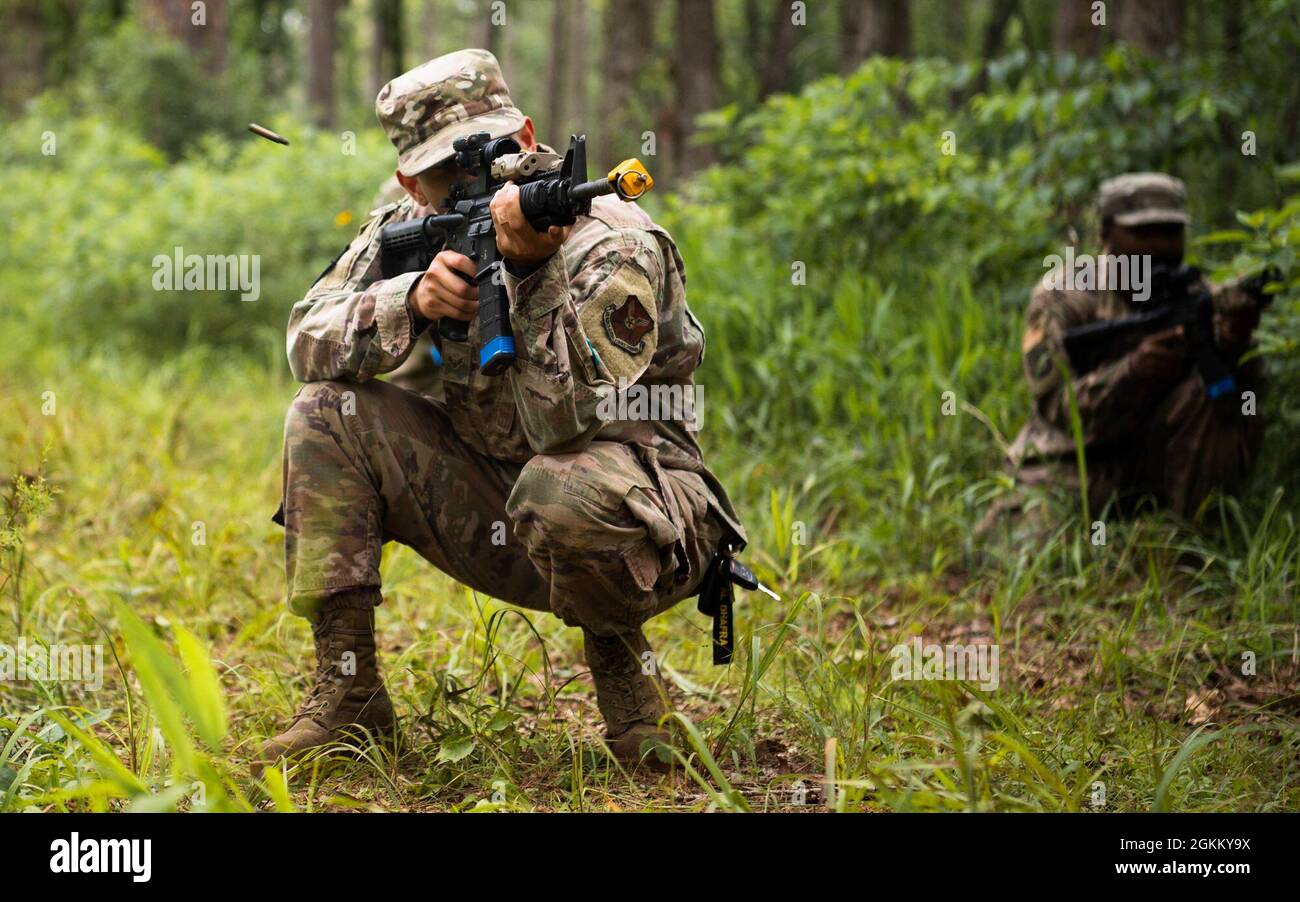 Master Sgt. Perry Link, 2nd Civil Engineer Squadron engineering flight superintendent, fires an M4 rifle during an individual movement techniques and unidentified explosive ordnance portion of a training exercise at Barksdale Air Force Base, Louisiana, May 20, 2021. Training operational skills such as land navigation, weapons assembly and individual movement techniques, the 2nd CES intensified the readiness of it’s engineers, allowing the unit to better adapt to changes in the national security environment and compete in the dynamic future of warfighting. Stock Photo