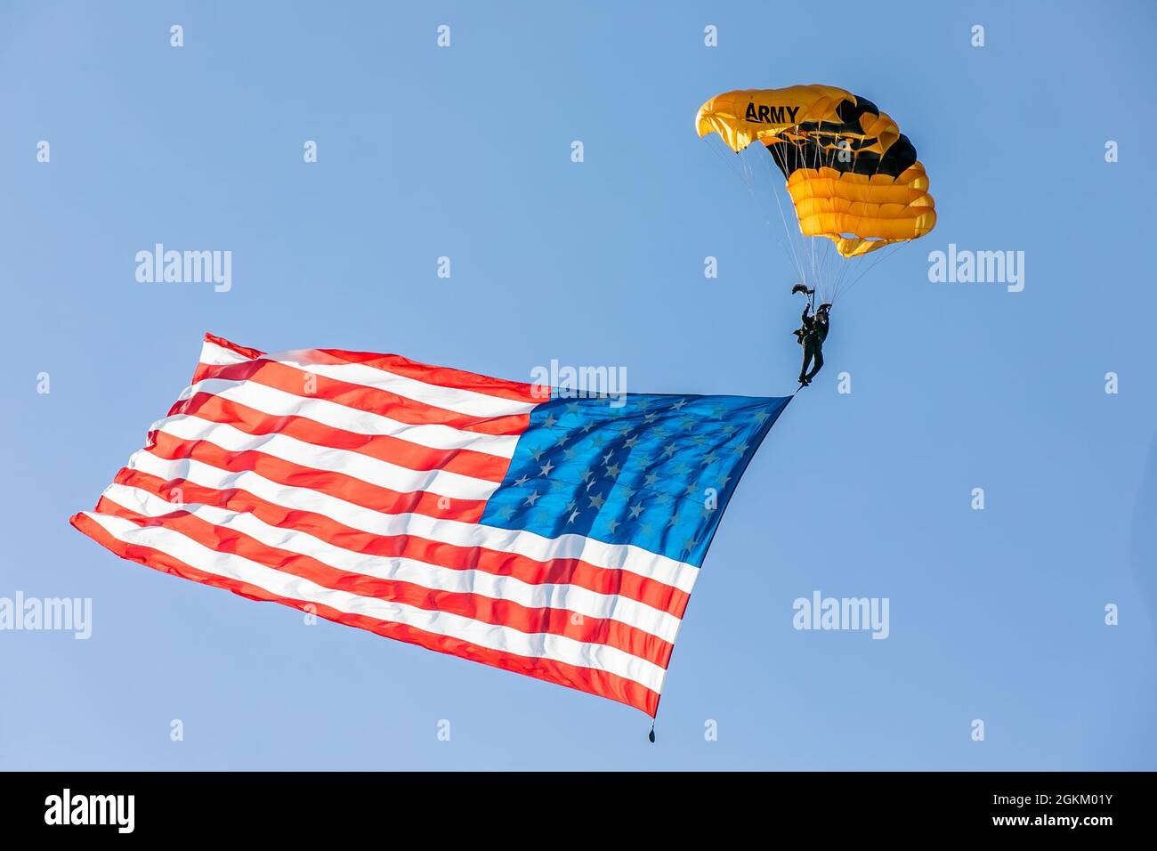 Staff Sgt. Dominic Perry makes a jump with the American flag banner over Laurinburg-Maxton Airport. Stock Photo