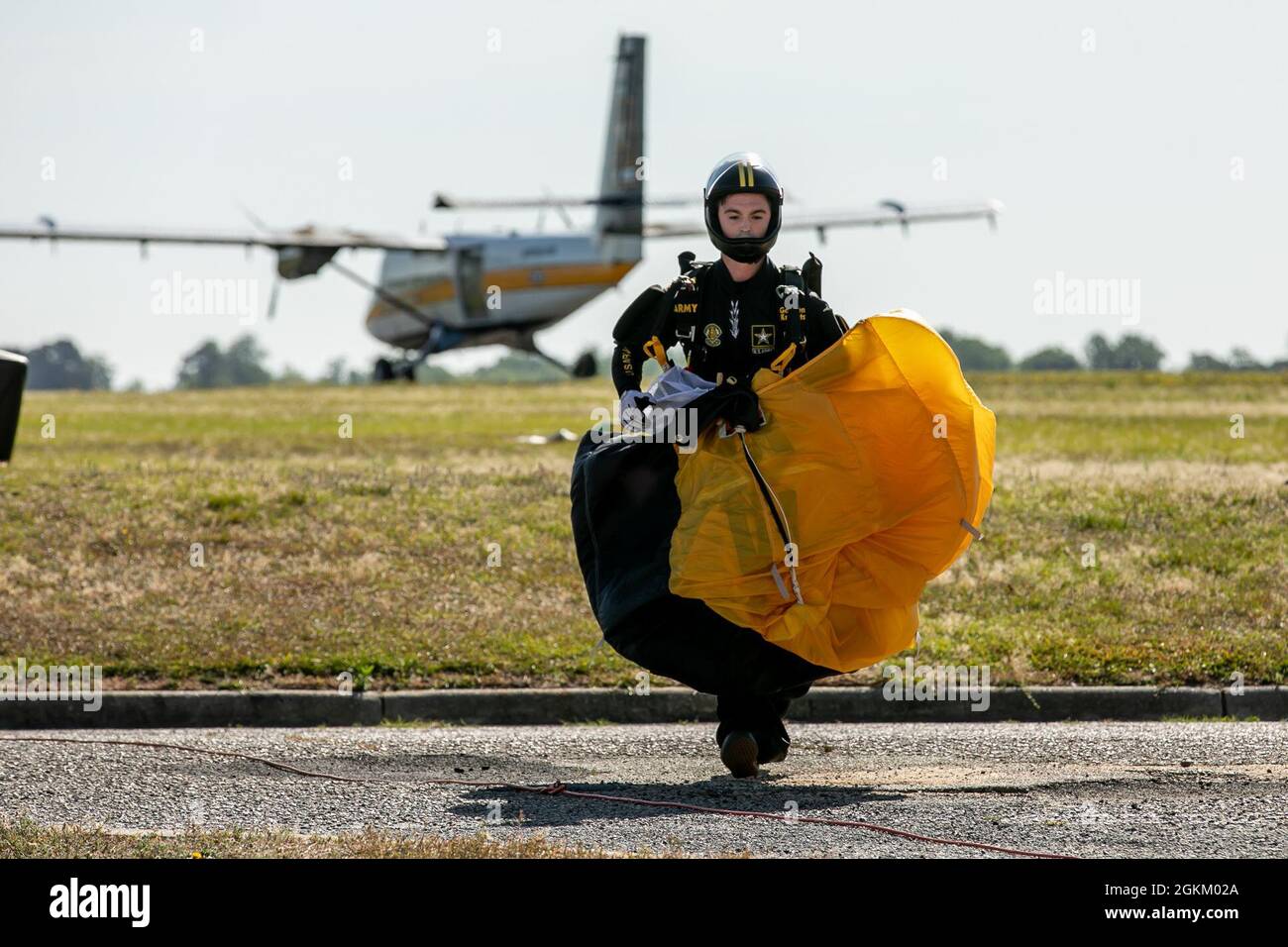 Staff Sgt. Mike Connors runs from a parachute landing at Laurinburg-Maxton Airport. Stock Photo