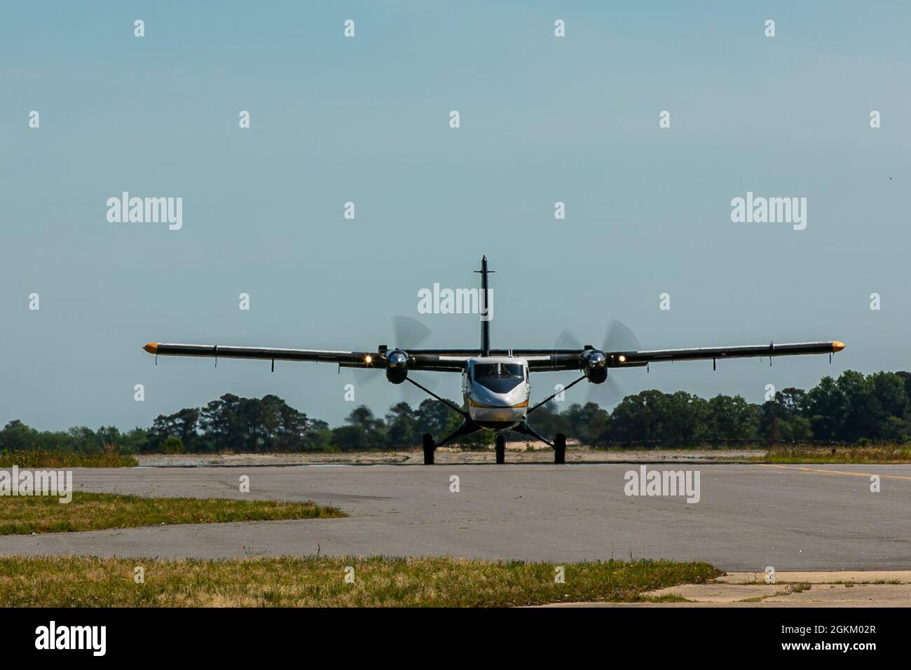 The C-147A, known as the Dash-8, arrives to pick up parachutists for the next airborne jump at Laurinburg- Maxton Airport. Stock Photo
