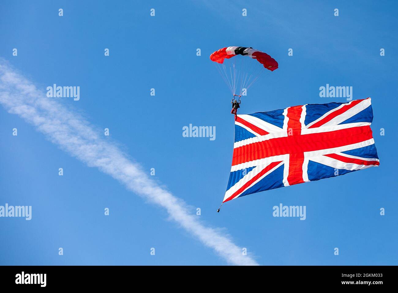 A member of the British Army Red Devils makes a jump with the British flag banner at Laurinburg- Maxton Airport. Stock Photo