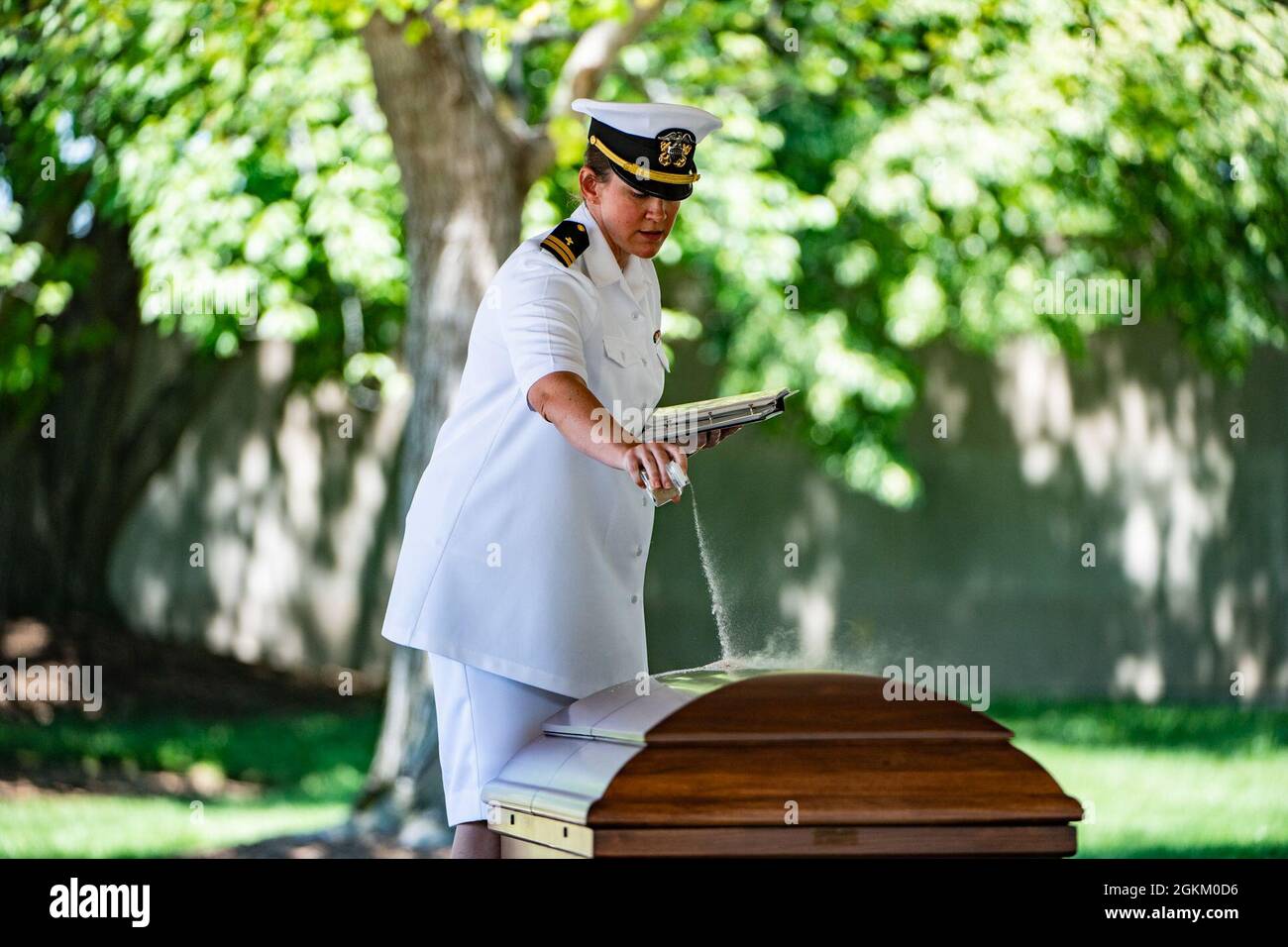 U.S. Navy Chaplain (Lt.) Chandler Irwin presides over the funeral service for U.S. Navy Radioman 3rd Class Thomas Griffith in Section 60 of Arlington National Cemetery, Arlington, Virginia, May 21, 2021.     Griffith was assigned to the battleship USS Oklahoma, which was moored at Ford Island, Pearl Harbor when it was attacked by Japanese aircraft on Dec. 7, 1941 during World War II. The USS Oklahoma sustained multiple torpedo hits, which caused it to quickly capsize. The attack on the ship resulted in the deaths of 429 crewmen, including Griffith, who was 20 years old. Griffith remained unide Stock Photo