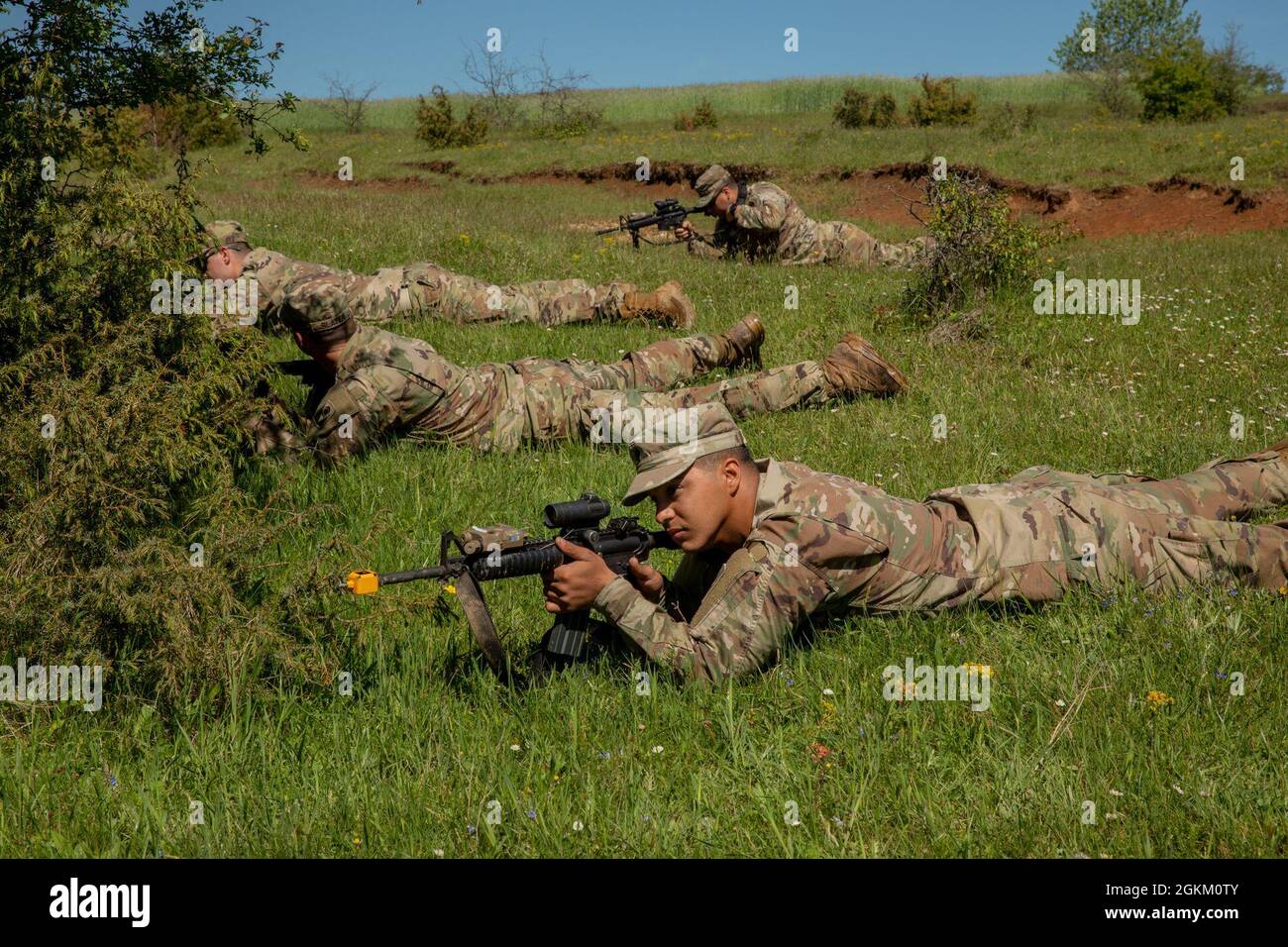 Soldiers from 2nd Battalion, 124th Infantry Regiment, 53rd Infantry Brigade Combat Team, prepare to ambush the enemy during a training lane at Manjača Training Area, Bosnia and Herzegovina, May 21, 2021. The 2-124th Soldiers have been training with the Armed Forces of Bosnia and Herzegovina for Immediate Response 21, an exercise that supports DEFENDER-Europe 21. DEFENDER-Europe 21 is a prime example of U.S. forces working together closely with NATO allies and partners in peacetime so together they can be prepared for any crisis. Stock Photo