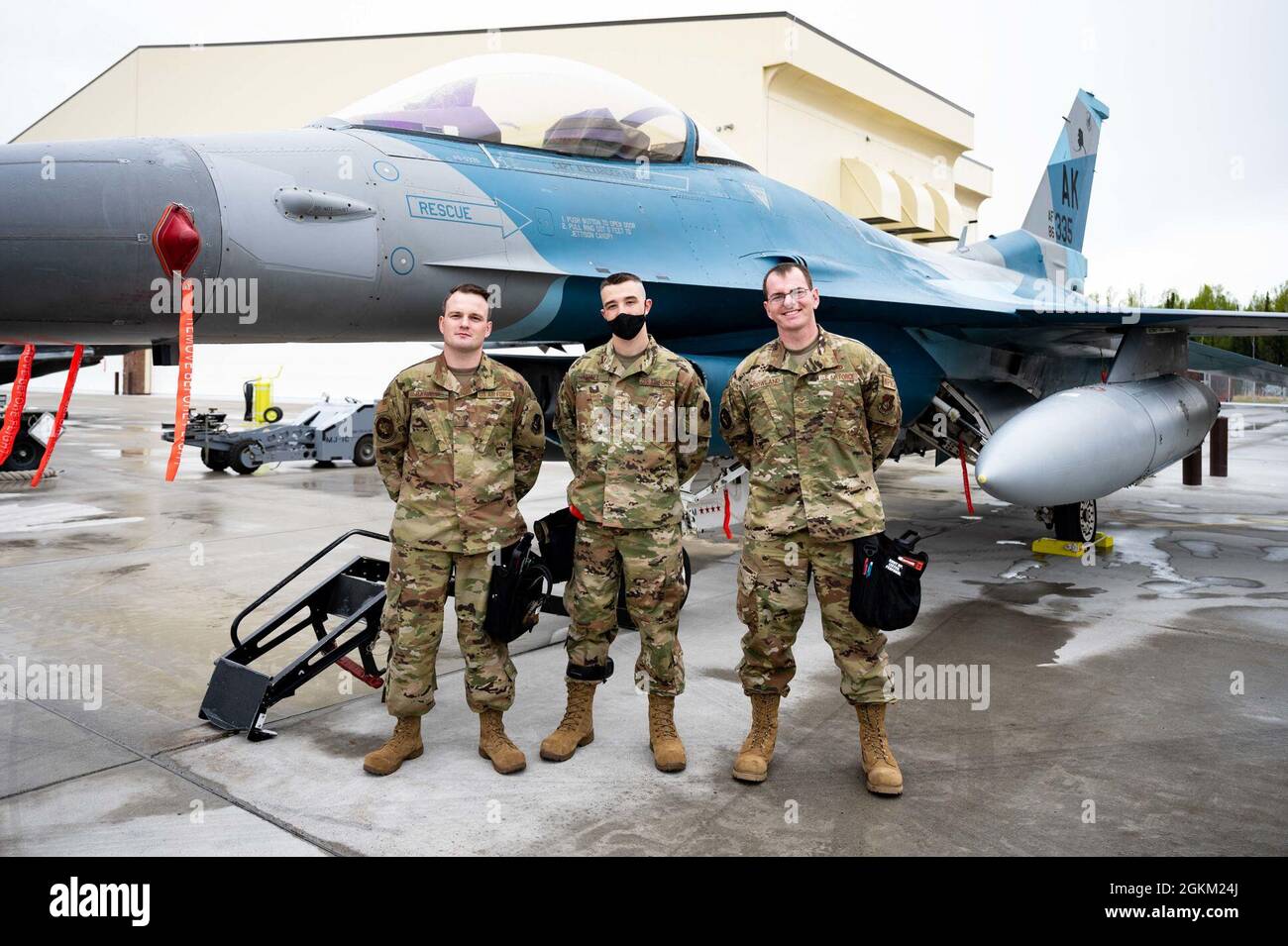 U.S. Airmen from the 18th Aircraft Maintenance Unit pose for a group