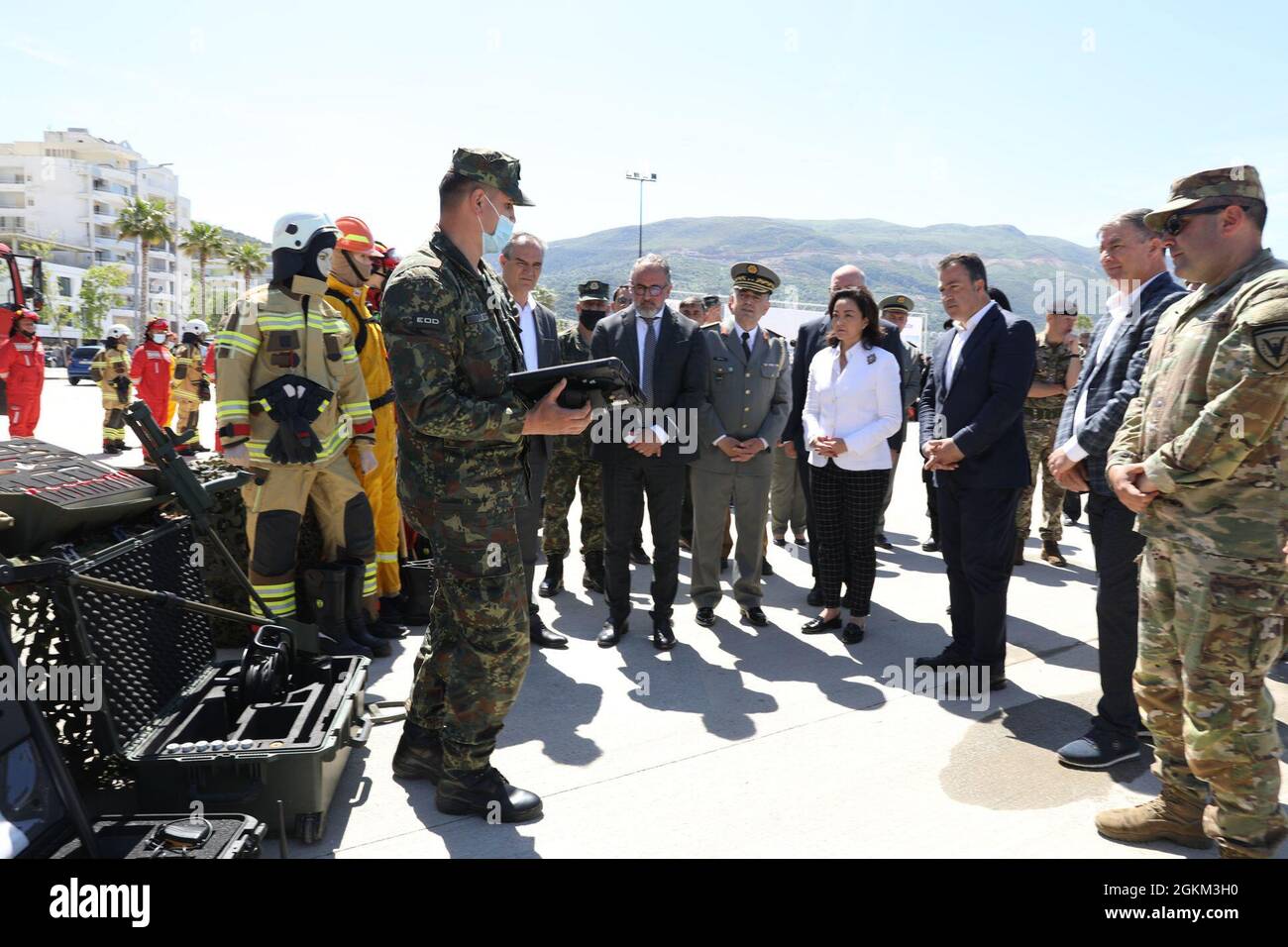 The Albanian Armed Forces Explosive Ordnance Disposal (EOD) unit briefs U.S. Ambassador to Albania Yuri Kim on  U.S.-donated equipment May 22, 2021, at a military sponsored open house in Vlore, Albania, held as part of DEFENDER-Europe 21 activities.  During the event, U.S. Ambassador to Albania Yuri Kim was briefed on the equipment and the continued U.S. commitment to peace and security in Albania, which includes decontamination of landmine and unexploded ordnance sites left over from previous conflict here. DEFENDER-Europe 21 is a large-scale U.S. Army-led exercise designed to build readiness Stock Photo